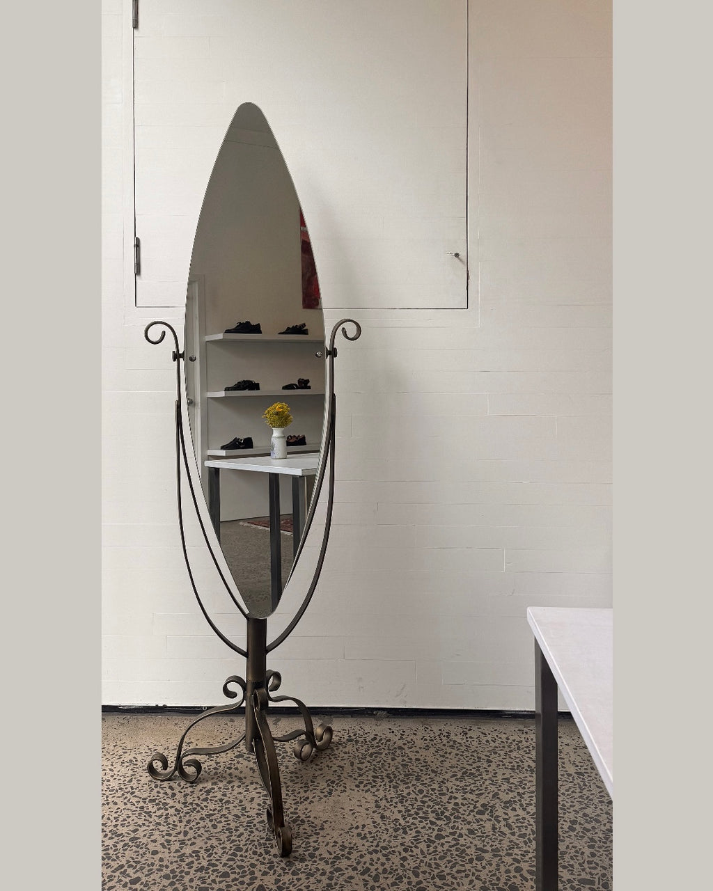 Full length swivel mirror on metal body with bronzed finish and spiral details