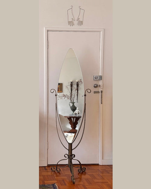 Full length swivel mirror on metal body with bronzed finish and spiral details