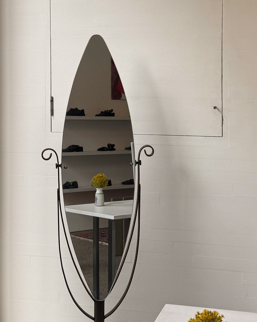 Full length swivel mirror on metal body with bronzed finish and spiral details
