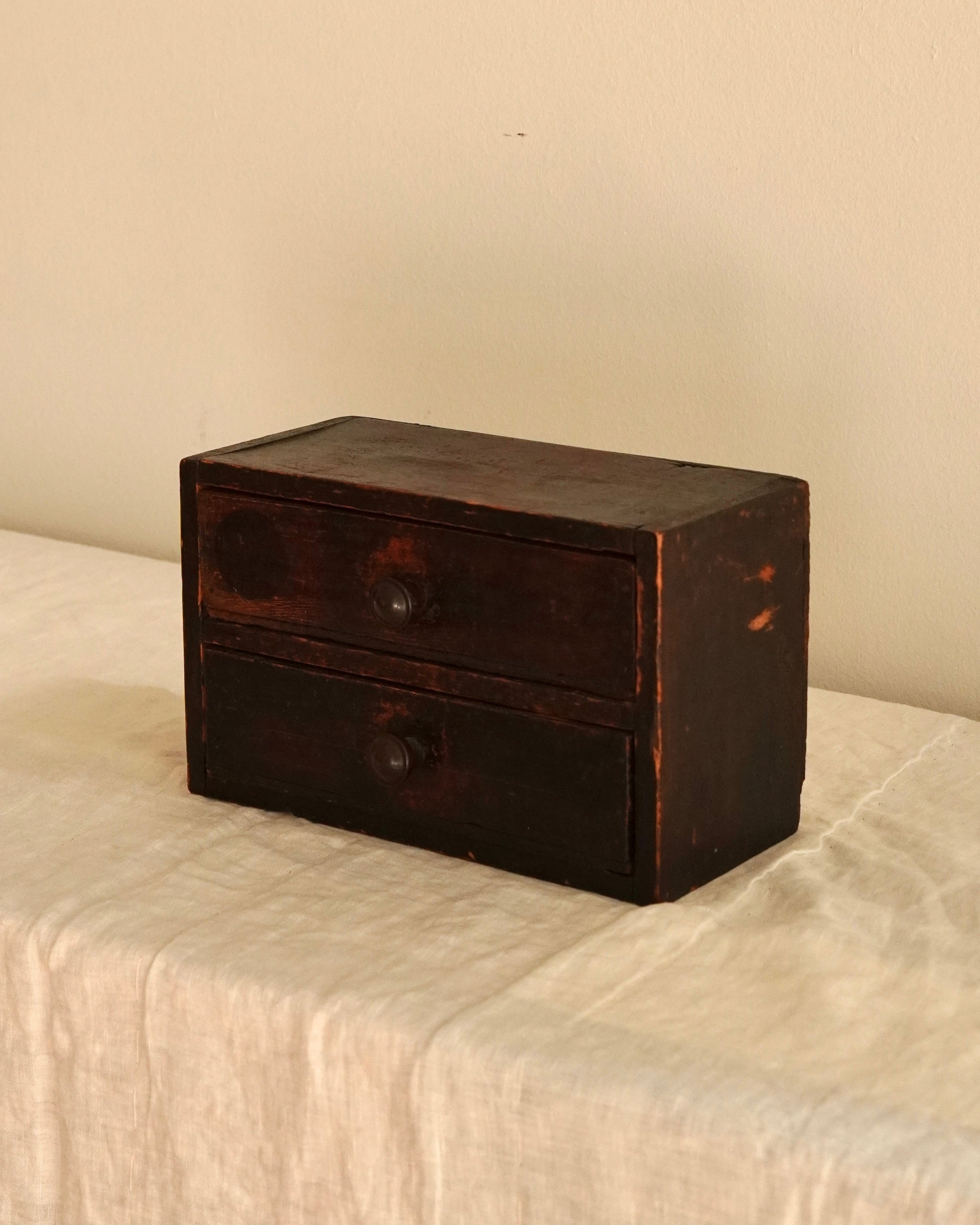 Small wooden chest of drawers