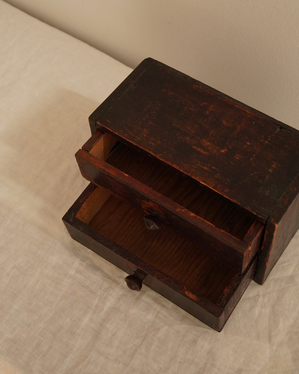 Small wooden chest of drawers