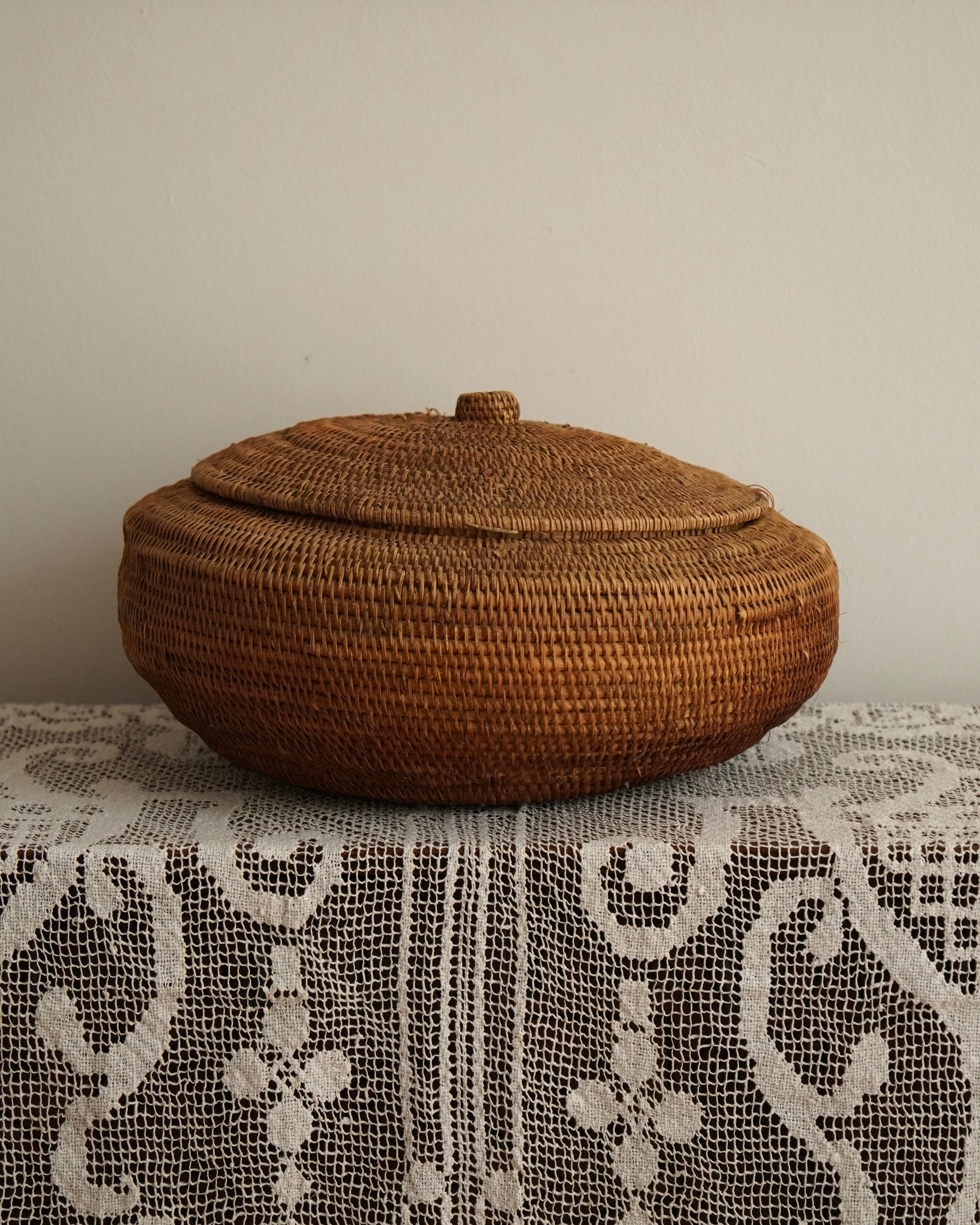 Large woven rattan container with lid