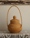 Woven rattan basket with handle and lid