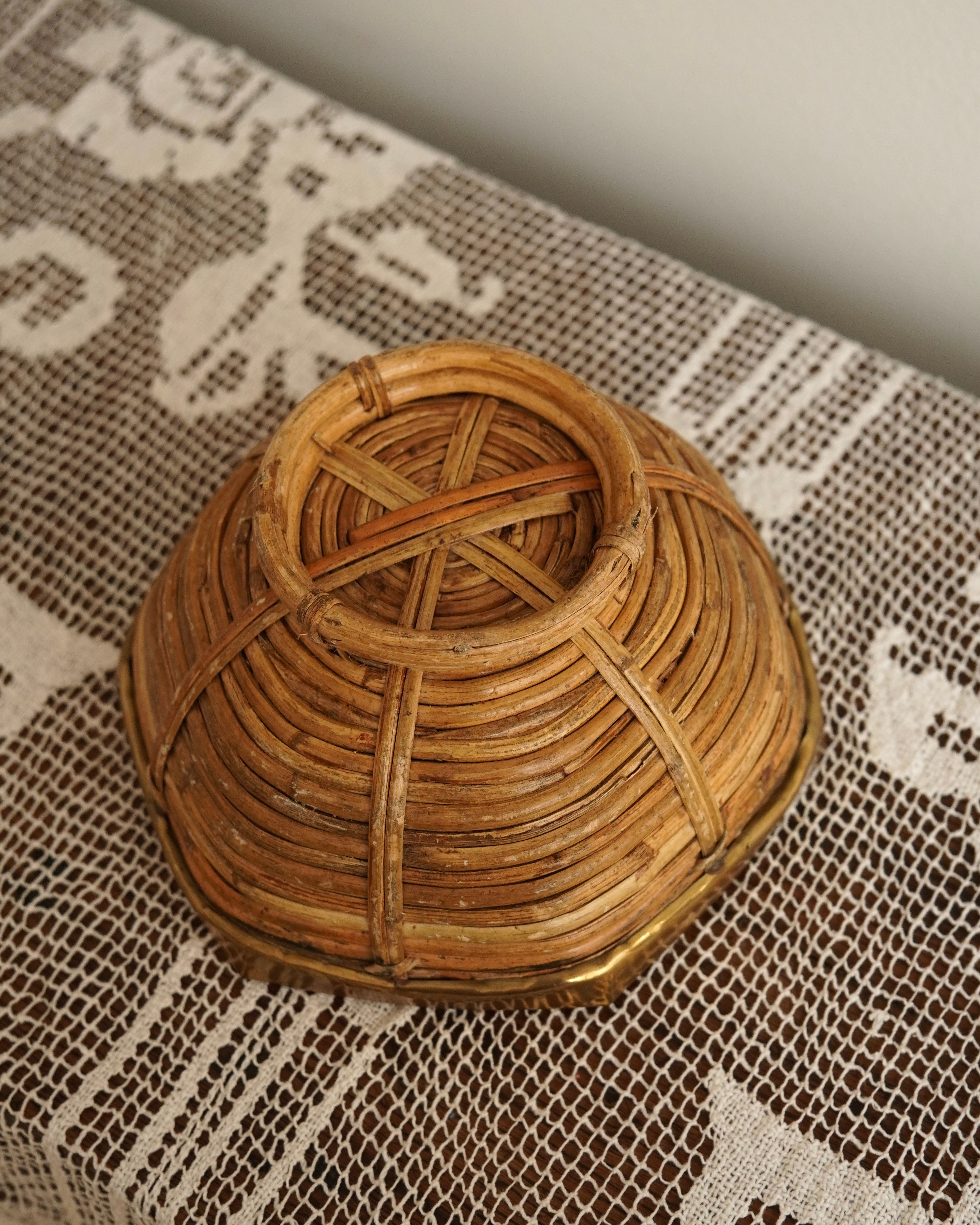 Brass trim and woven rattan bowl likely by Gabriella Crespi