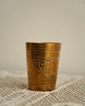 Brass cup with engravings