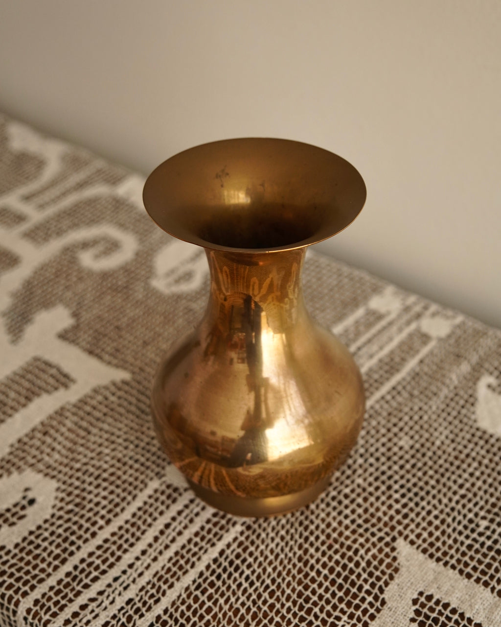 Tall rounded solid brass vase