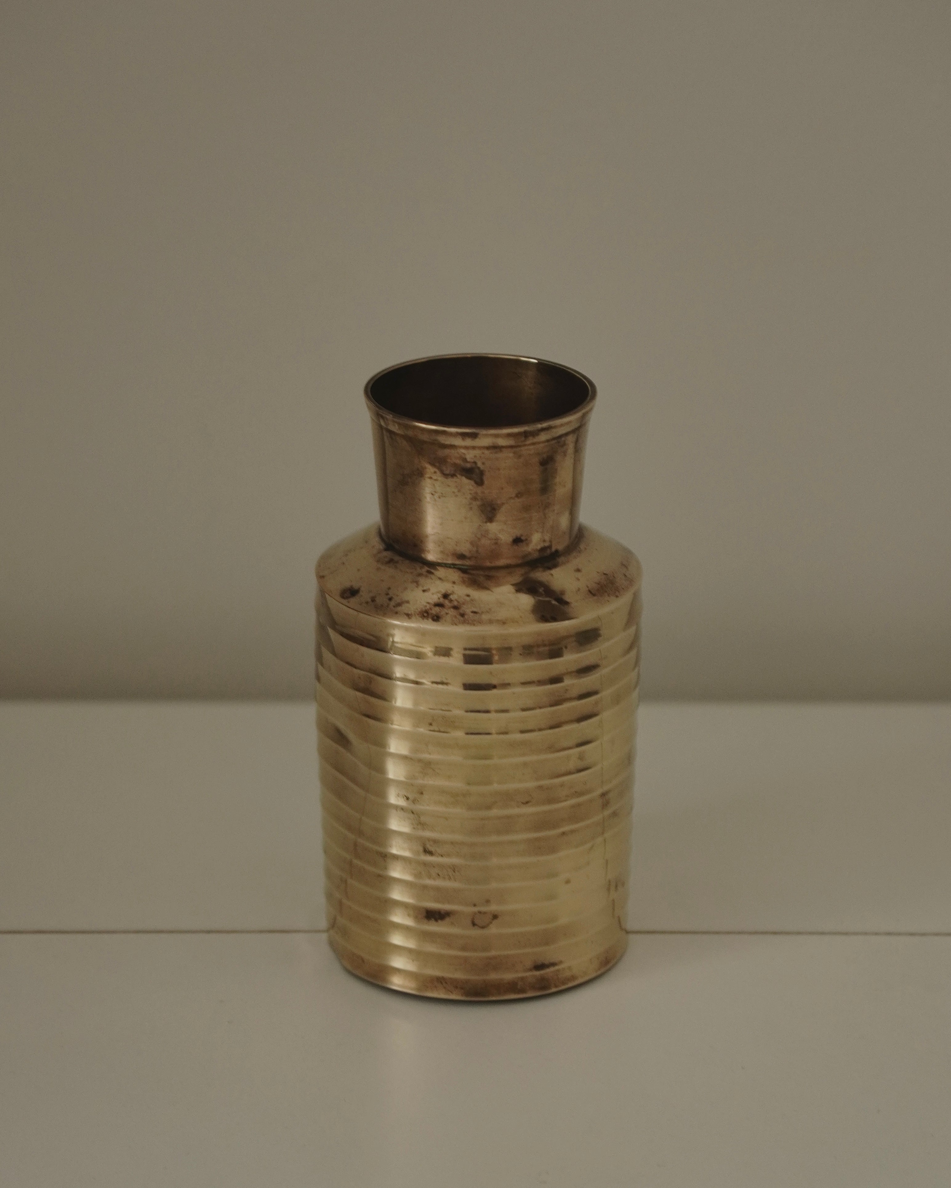 Brass vase with concave ribbing