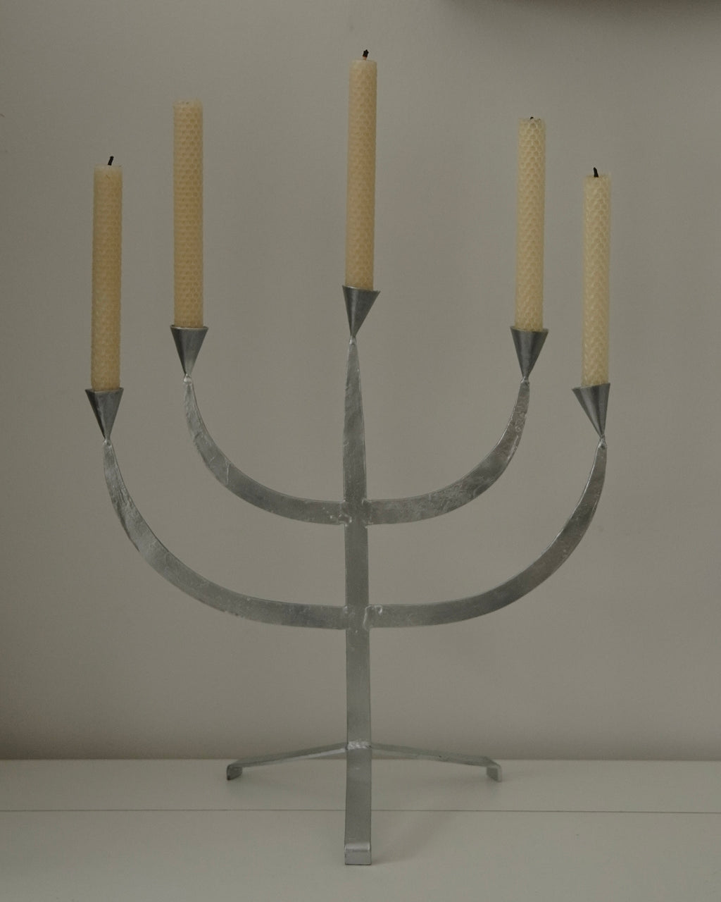 Silver coloured metal candelabra, holds 5