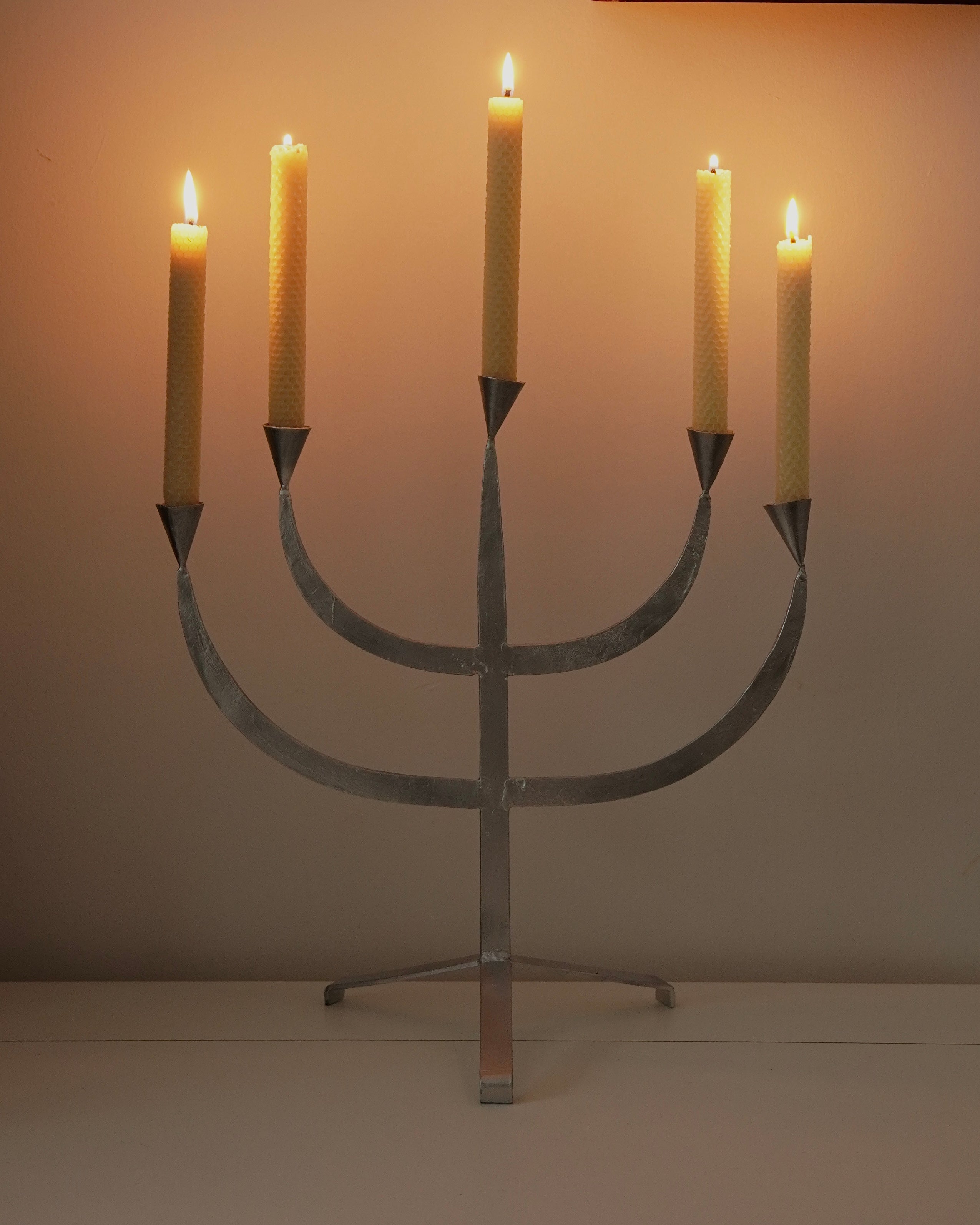 Silver coloured metal candelabra, holds 5