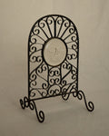 Glass sun face on metal spiral frame with feet