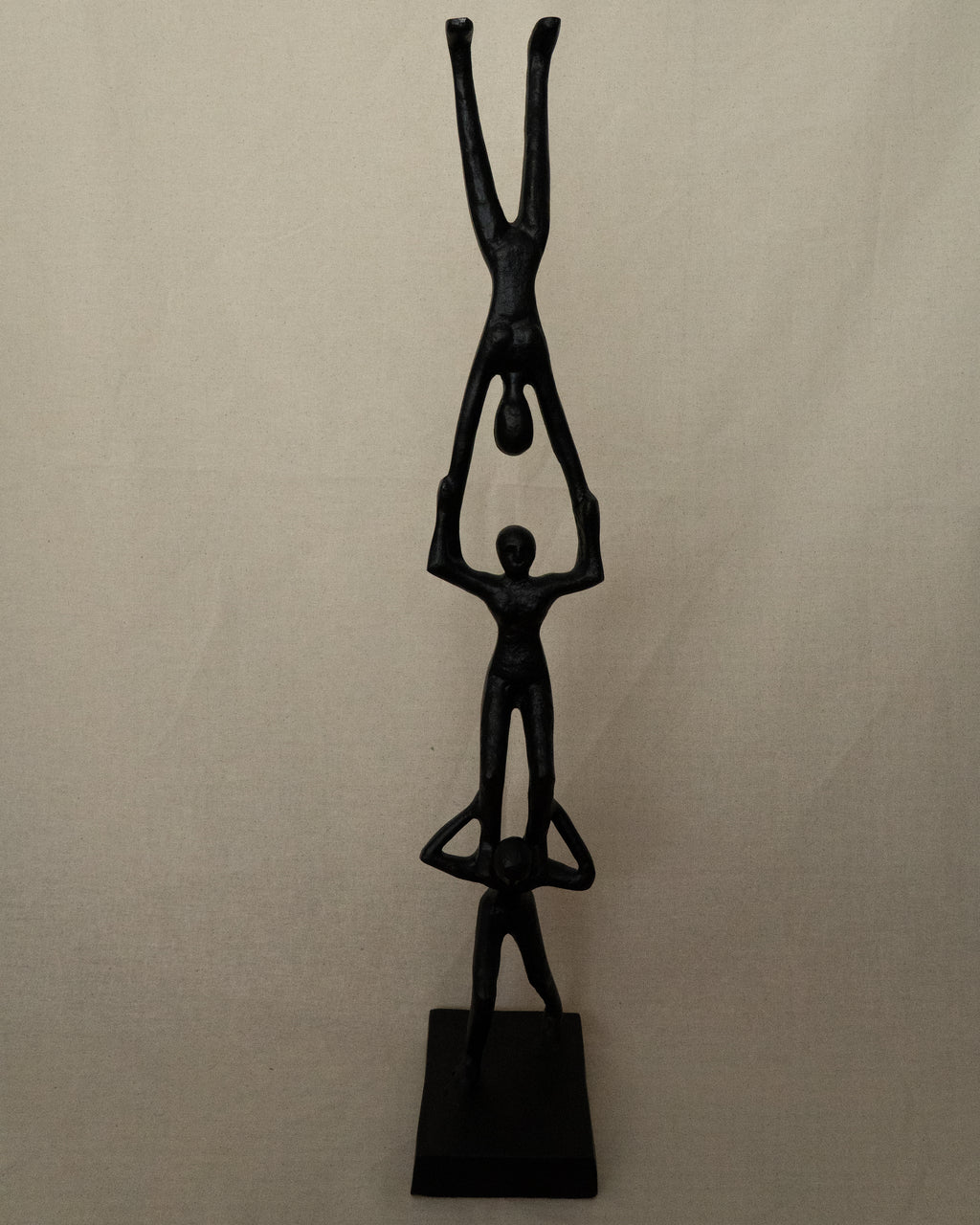 Trio of acrobats metal sculpture in black