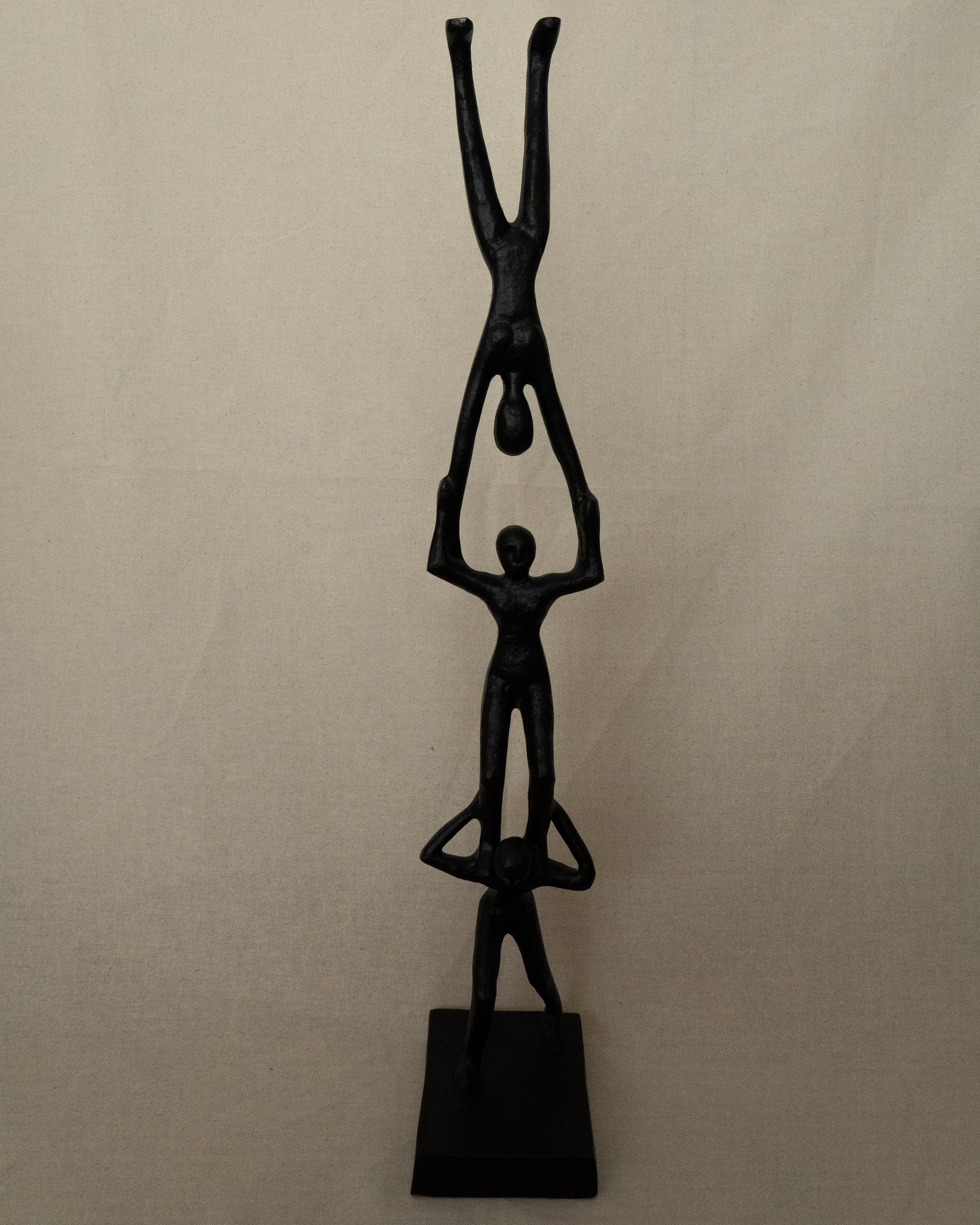 Trio of acrobats metal sculpture in black
