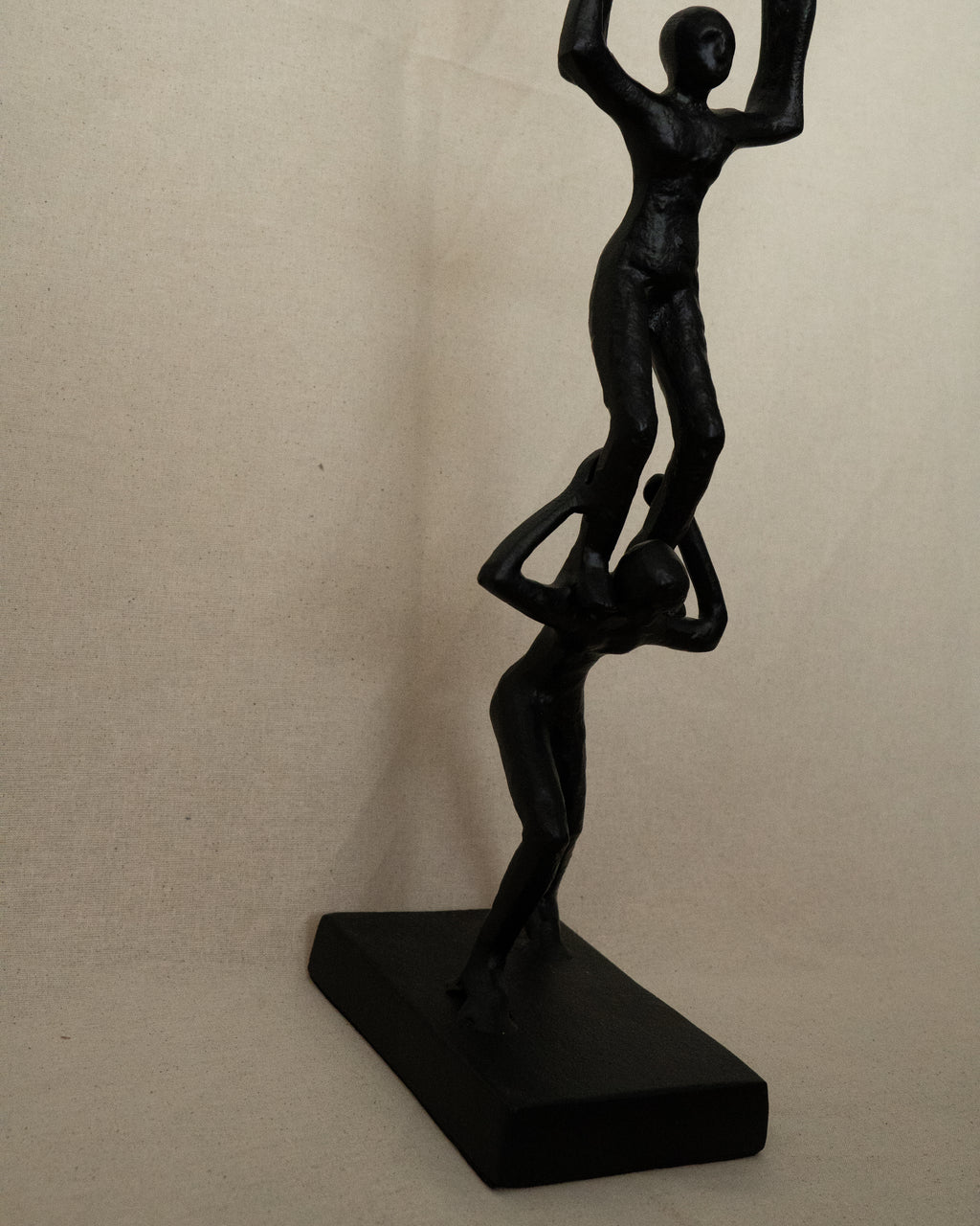 Trio of acrobats metal sculpture in black