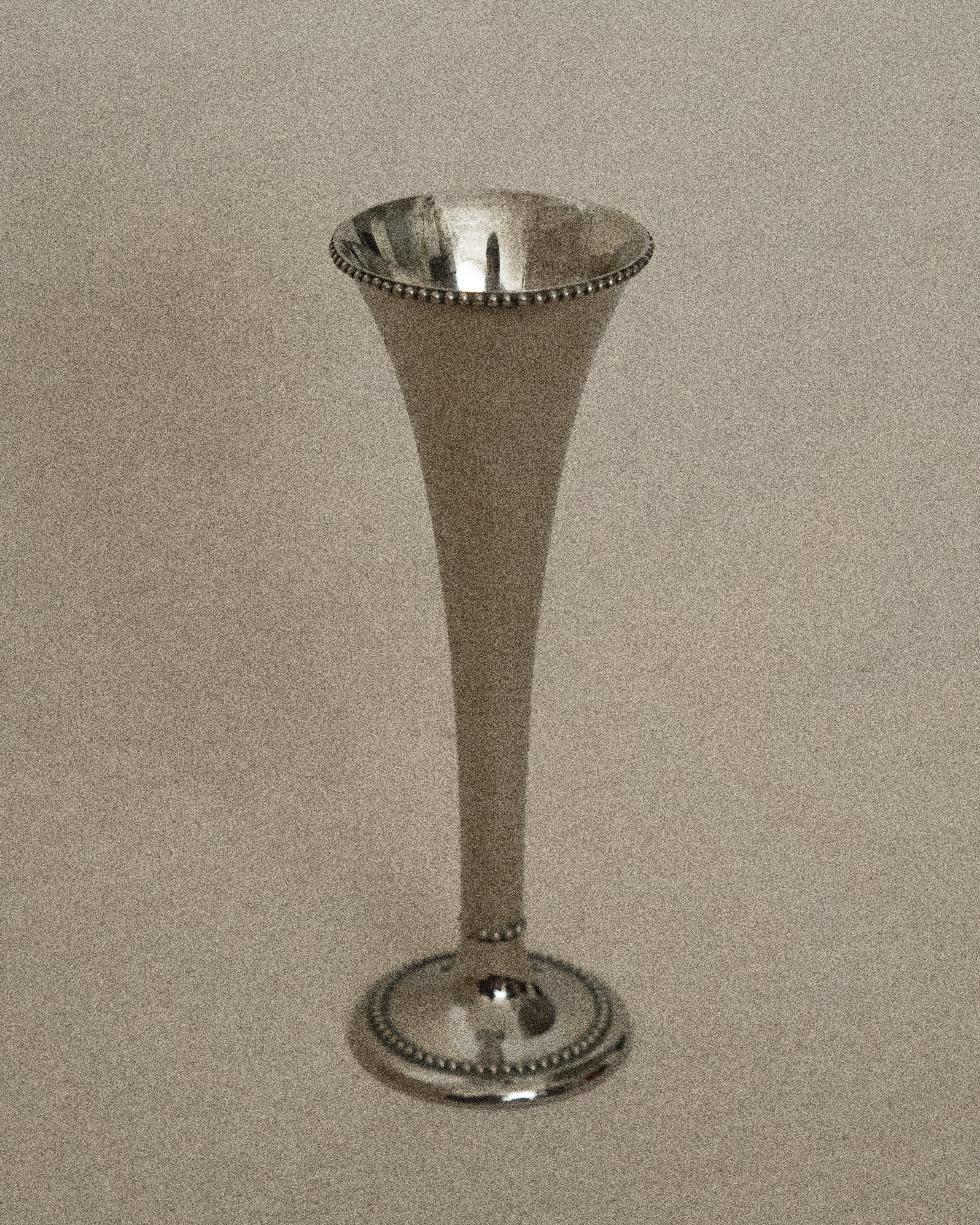 Silver plated conical vase with tiny spheres