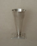 Conical aluminum vase with square stepped base