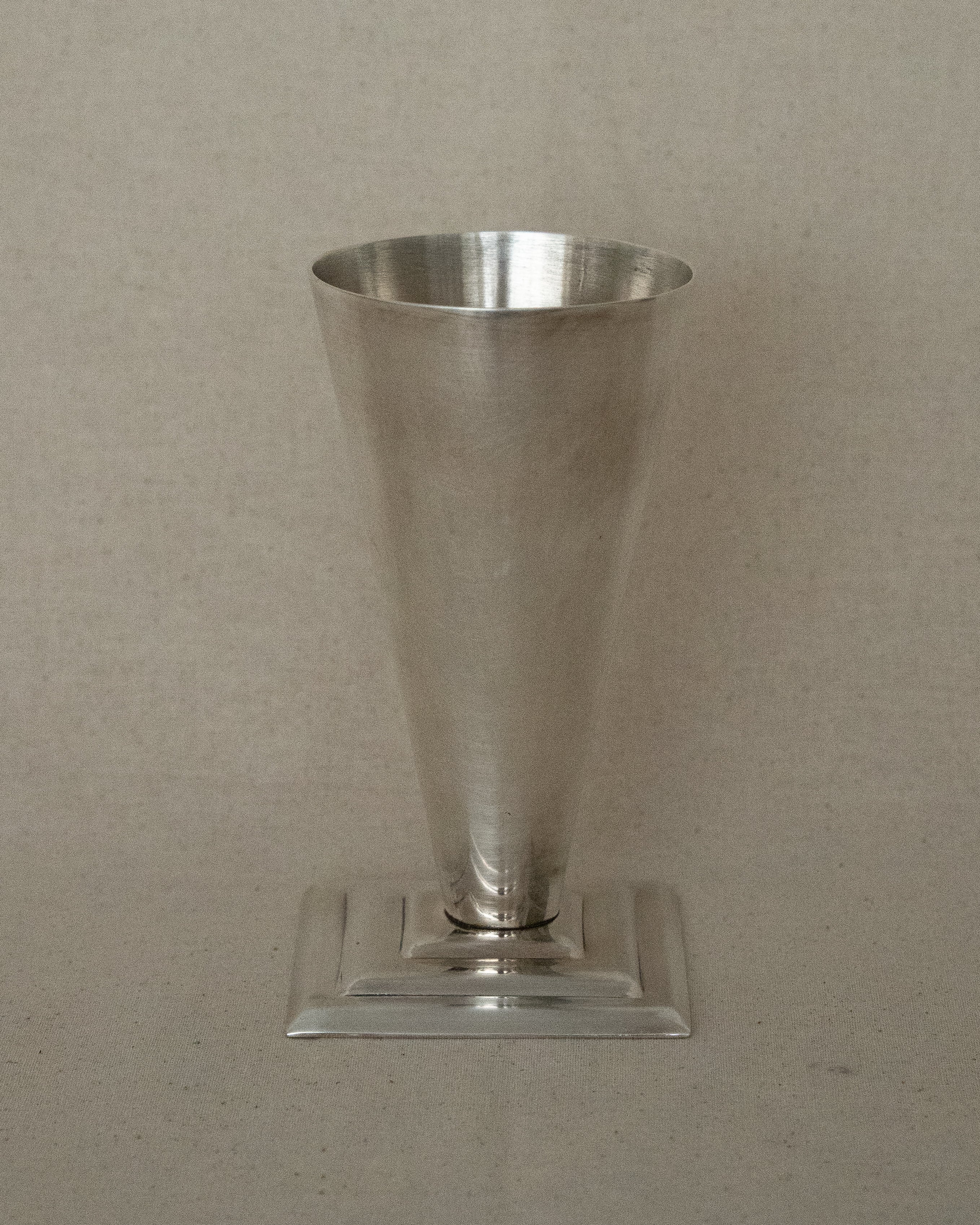 Conical aluminum vase with square stepped base