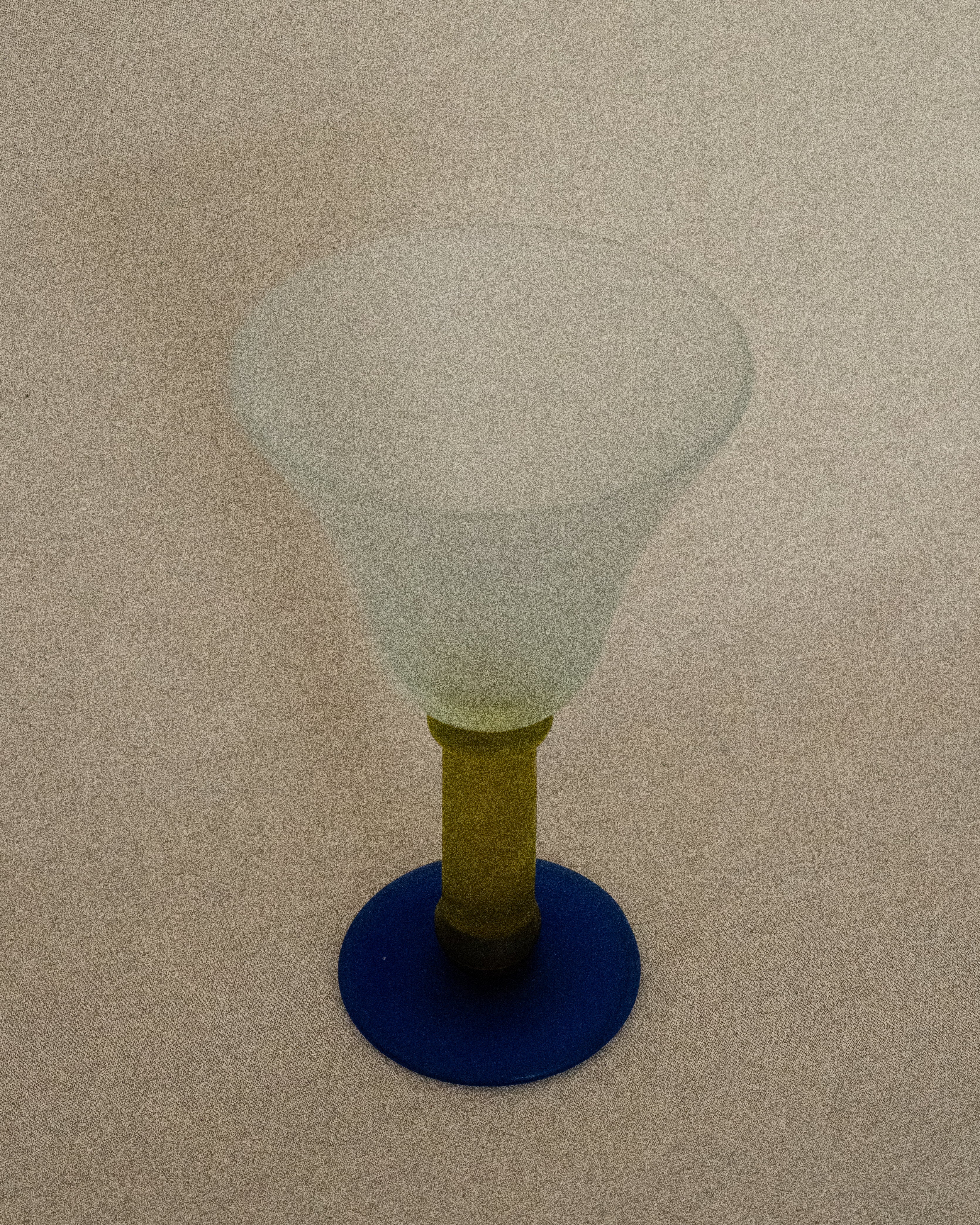 Translucent green and blue wine glass