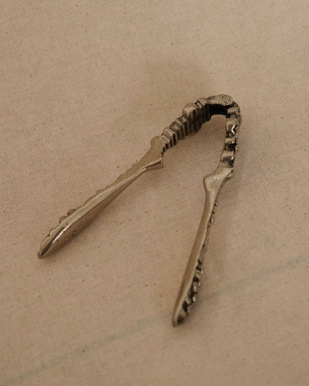 Solid metal nut cracker