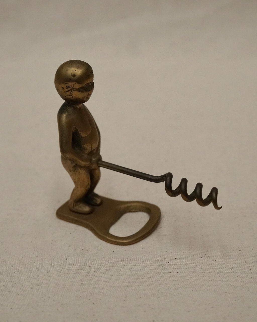 Male brass bottle opener and corkscrew