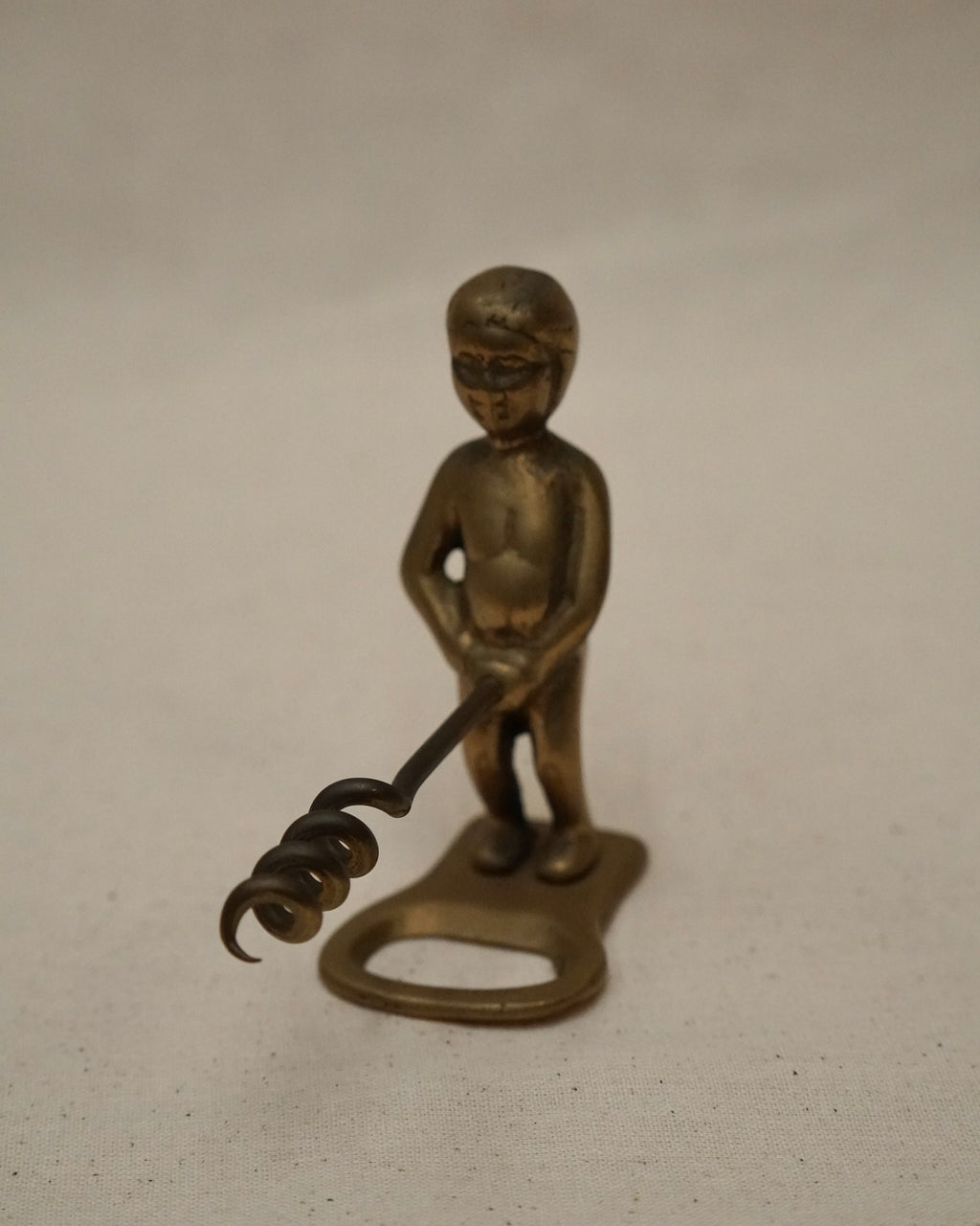 Male brass bottle opener and corkscrew