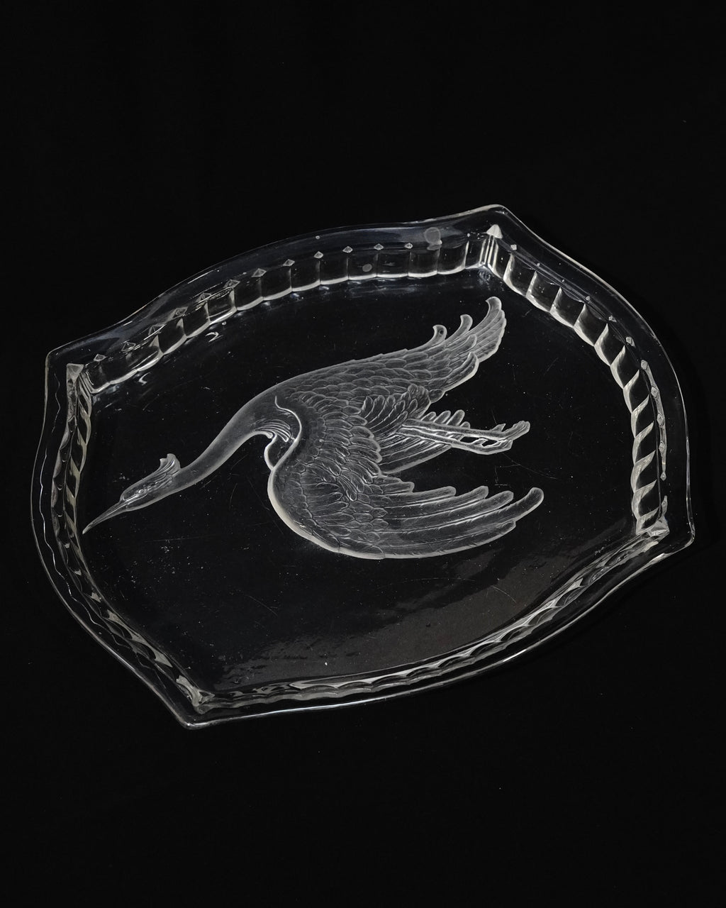 Glass tray with carved out crane
