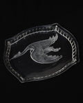 Glass tray with carved out crane