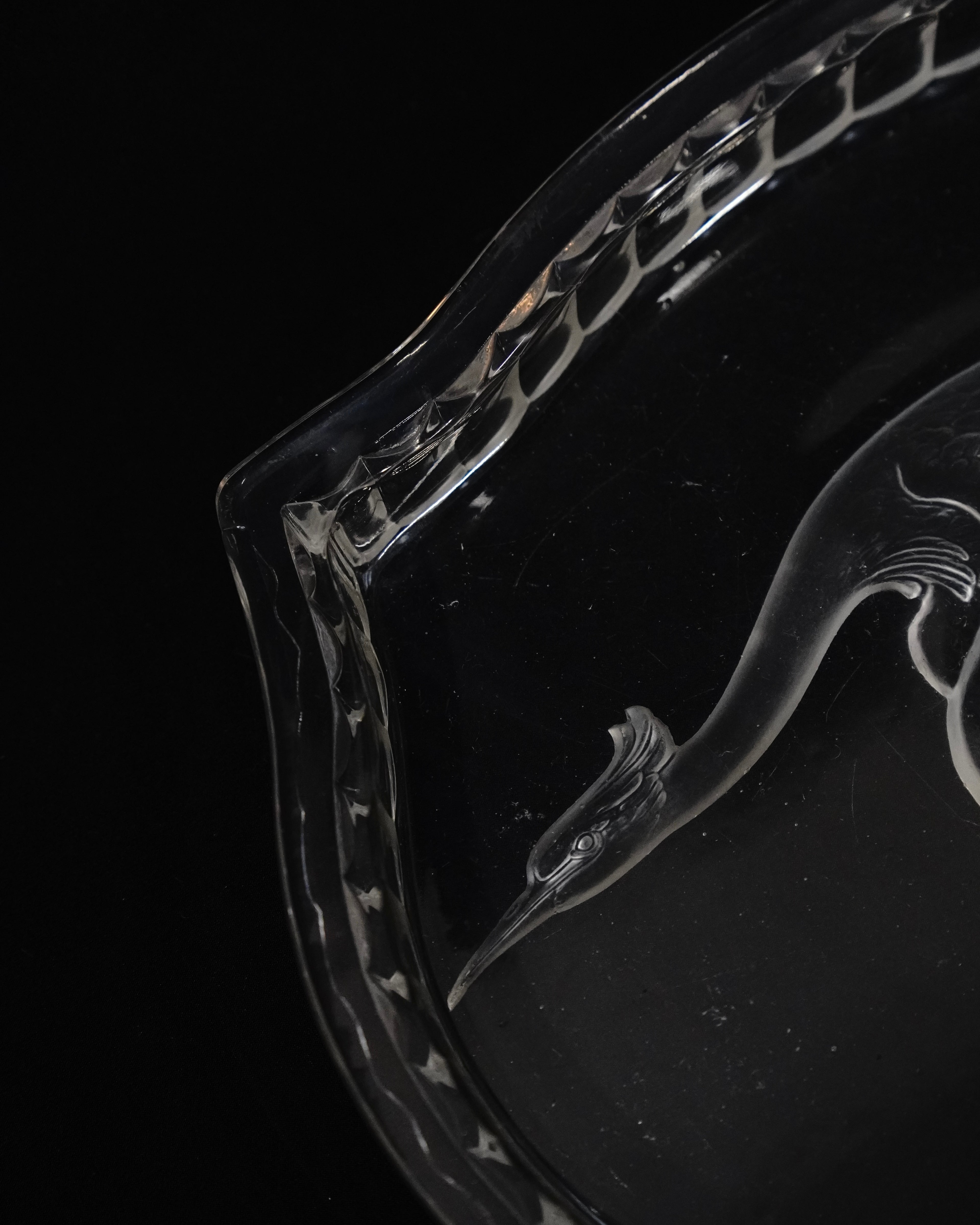 Glass tray with carved out crane