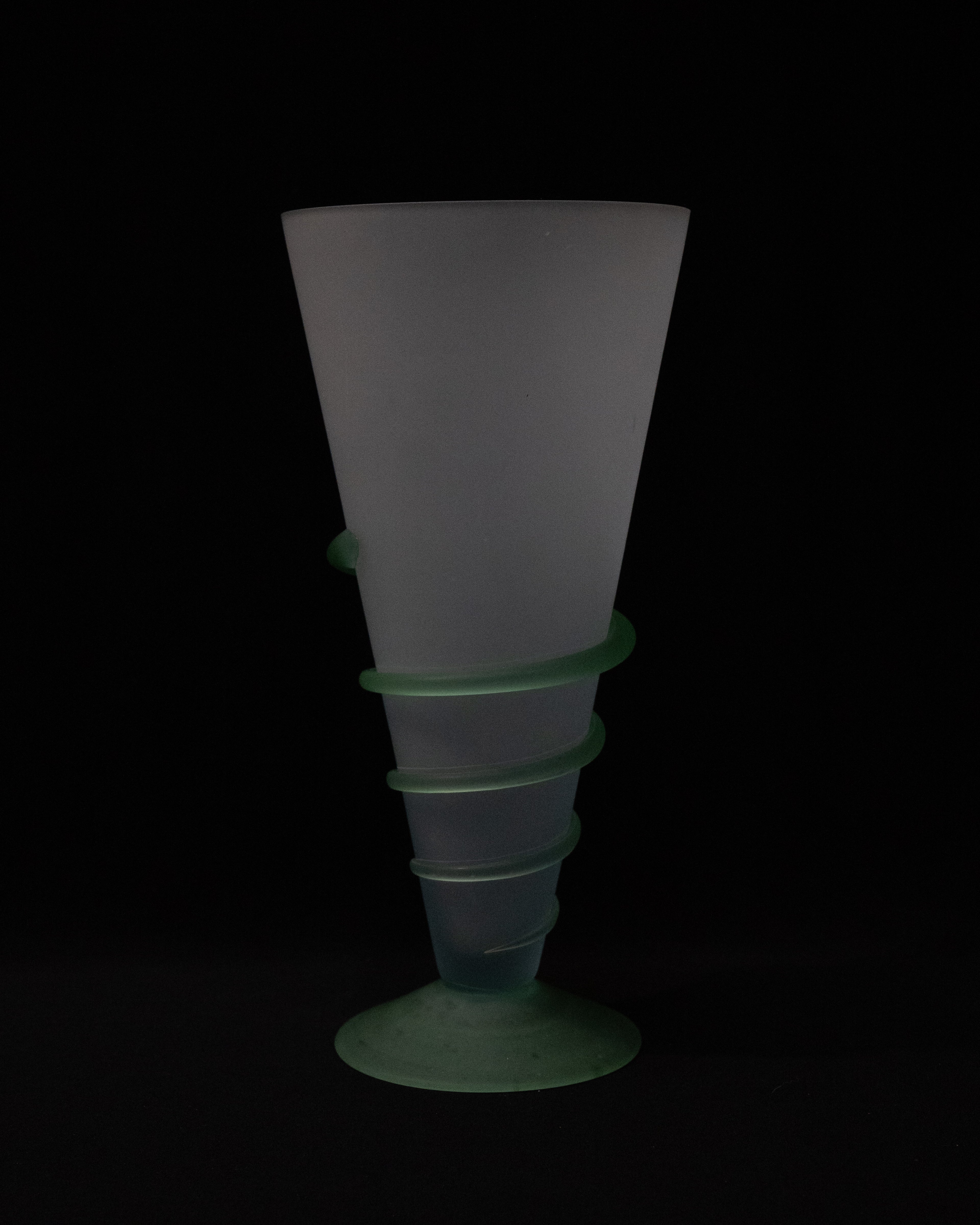 Art glass translucent vase with light green base and swirl detail