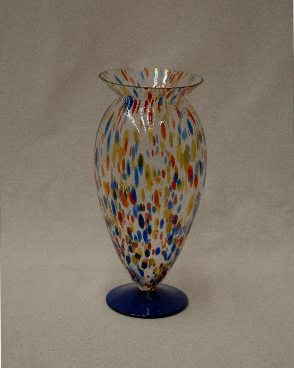 Art glass vase with colourful marks and blue base