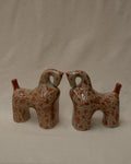 Pair of ceramic horses in pink and brown