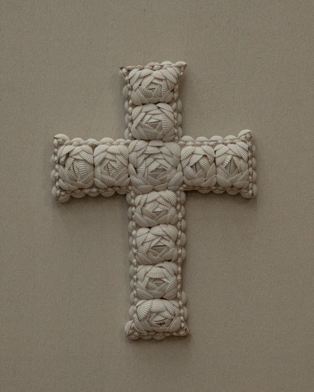 Cross wall hanging decorated with shells