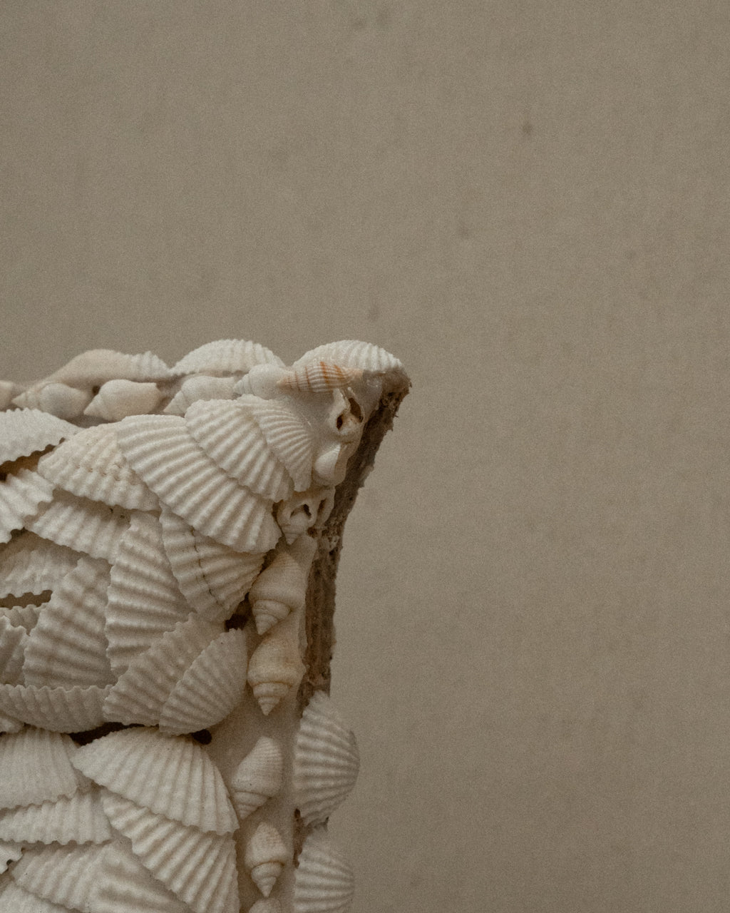 Cross wall hanging decorated with shells