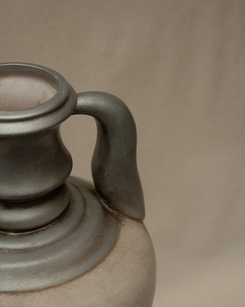Silver and white painted terracotta vase