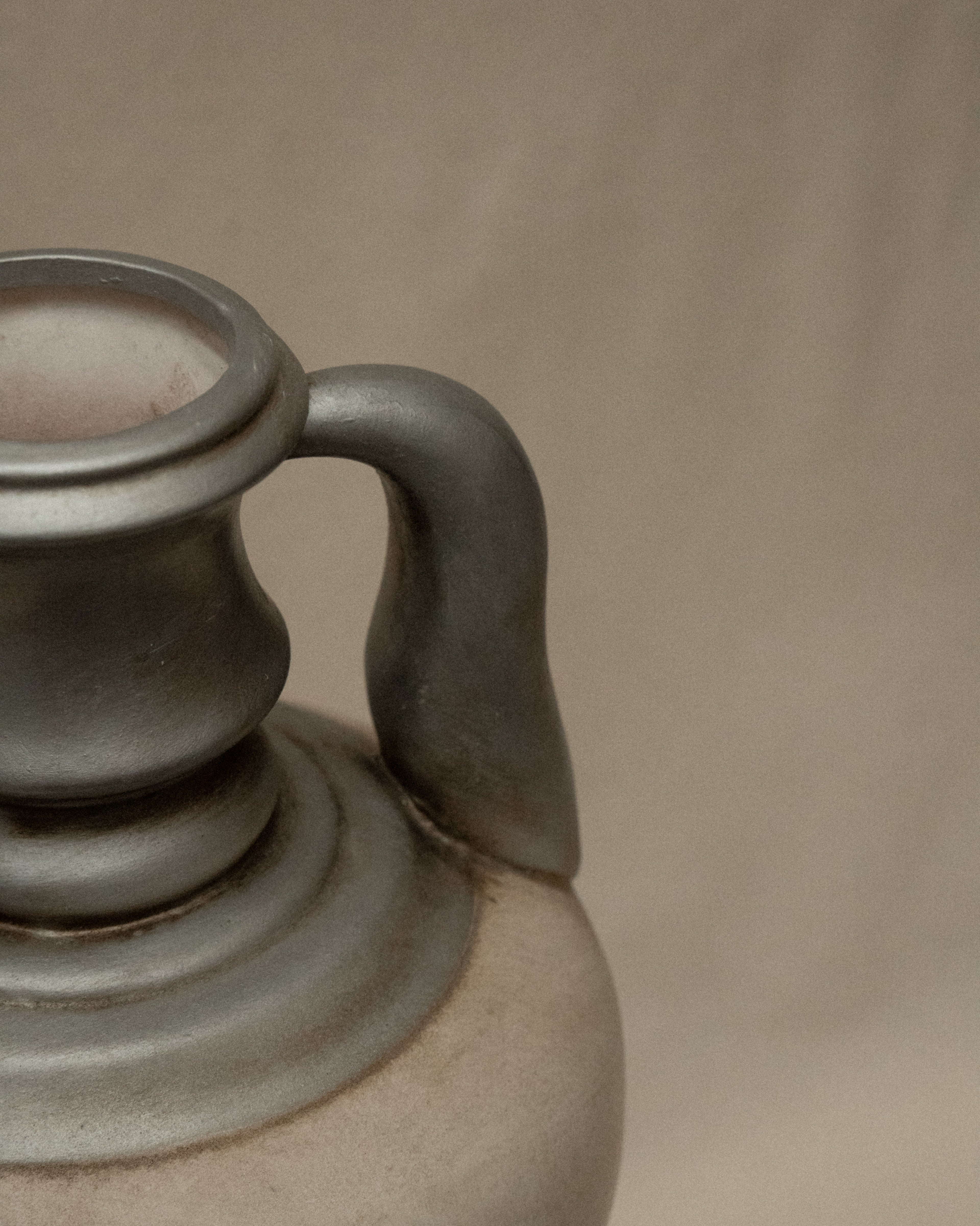 Silver and white painted terracotta vase