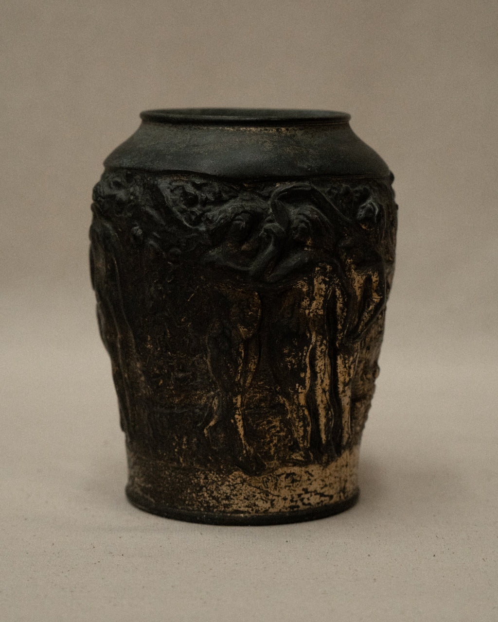 Art deco metal vase with nude figures and angel amongst nature