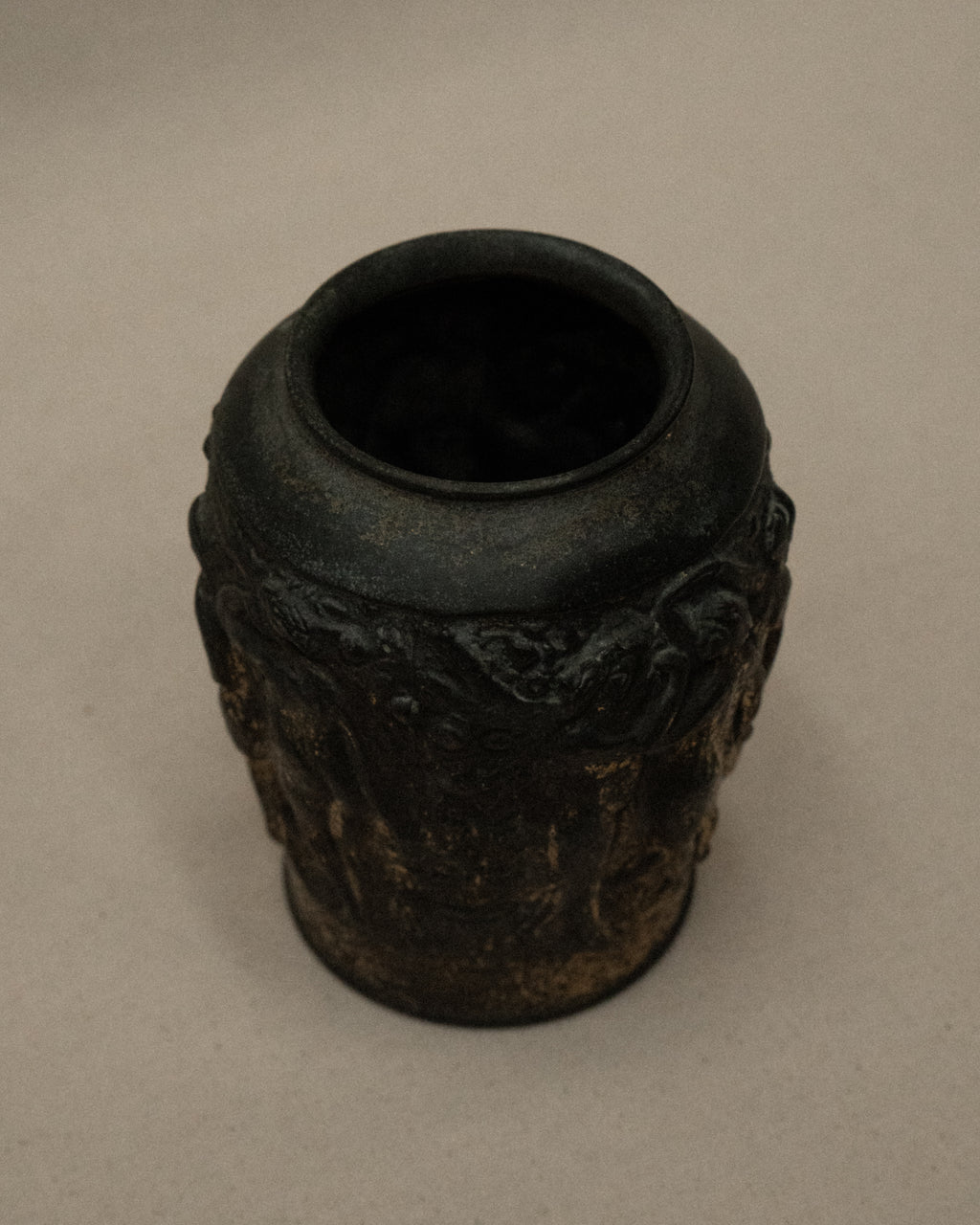 Art deco metal vase with nude figures and angel amongst nature