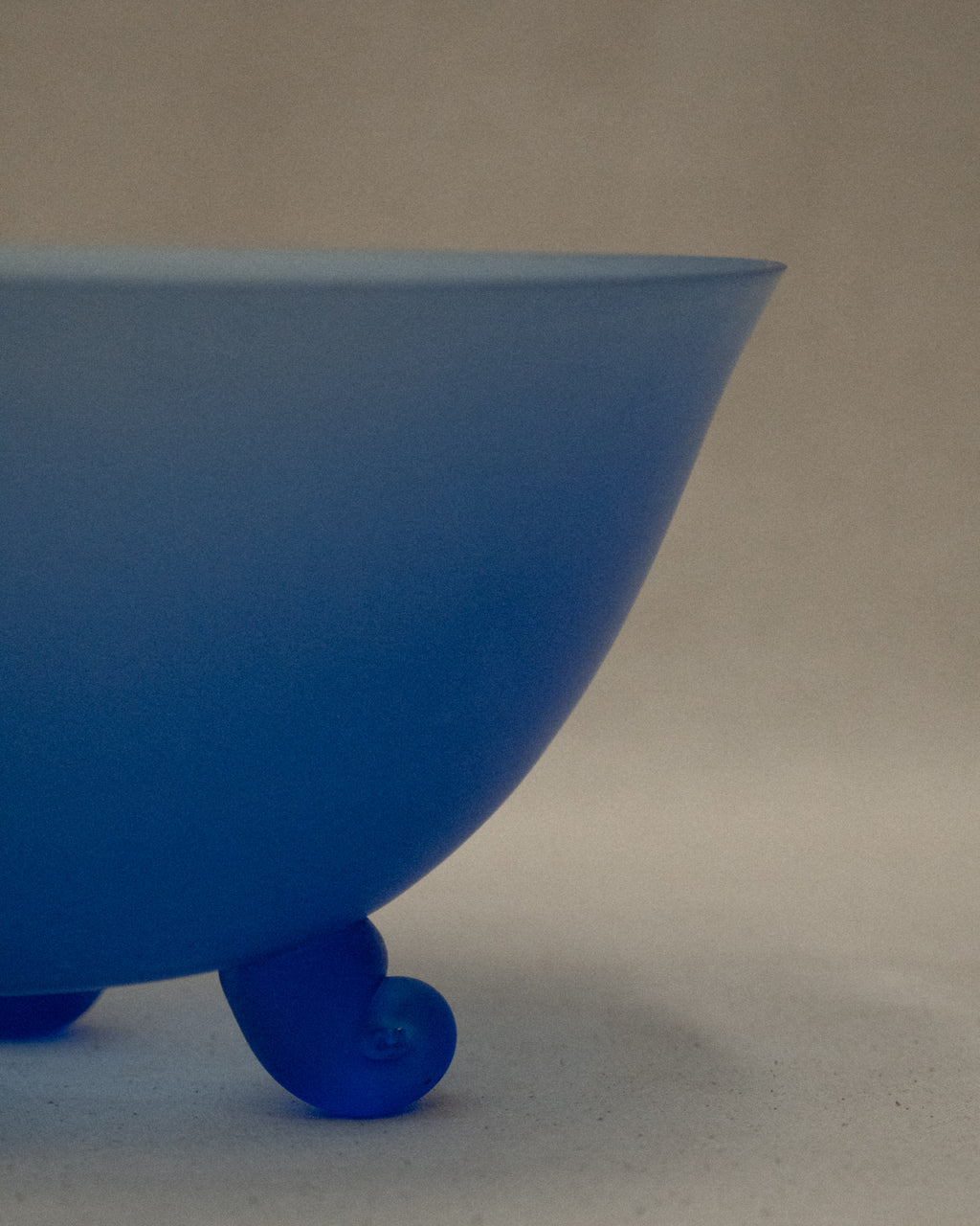 Blue glass bowl with spiral feet