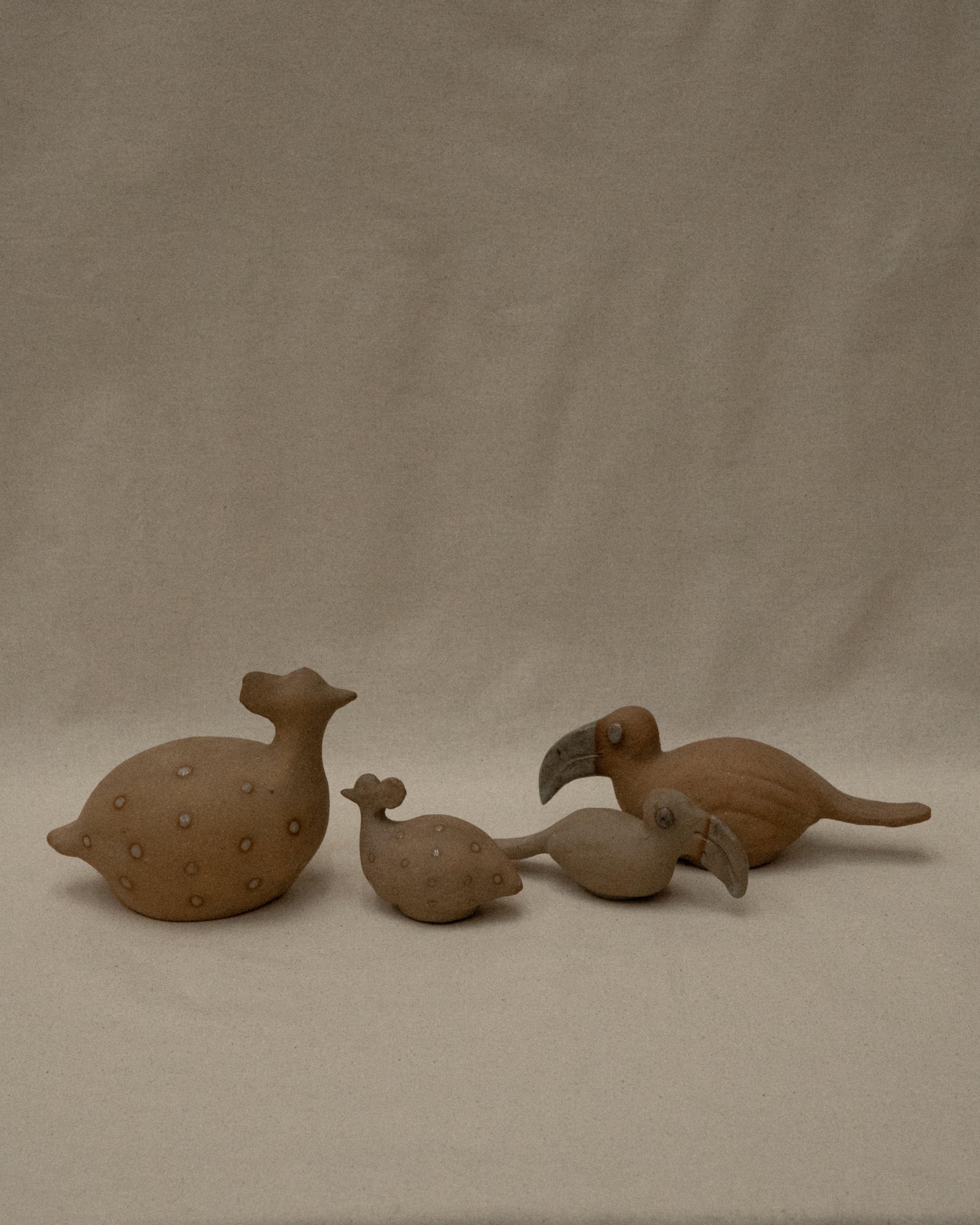 Ceramic toucans and guinea fowls