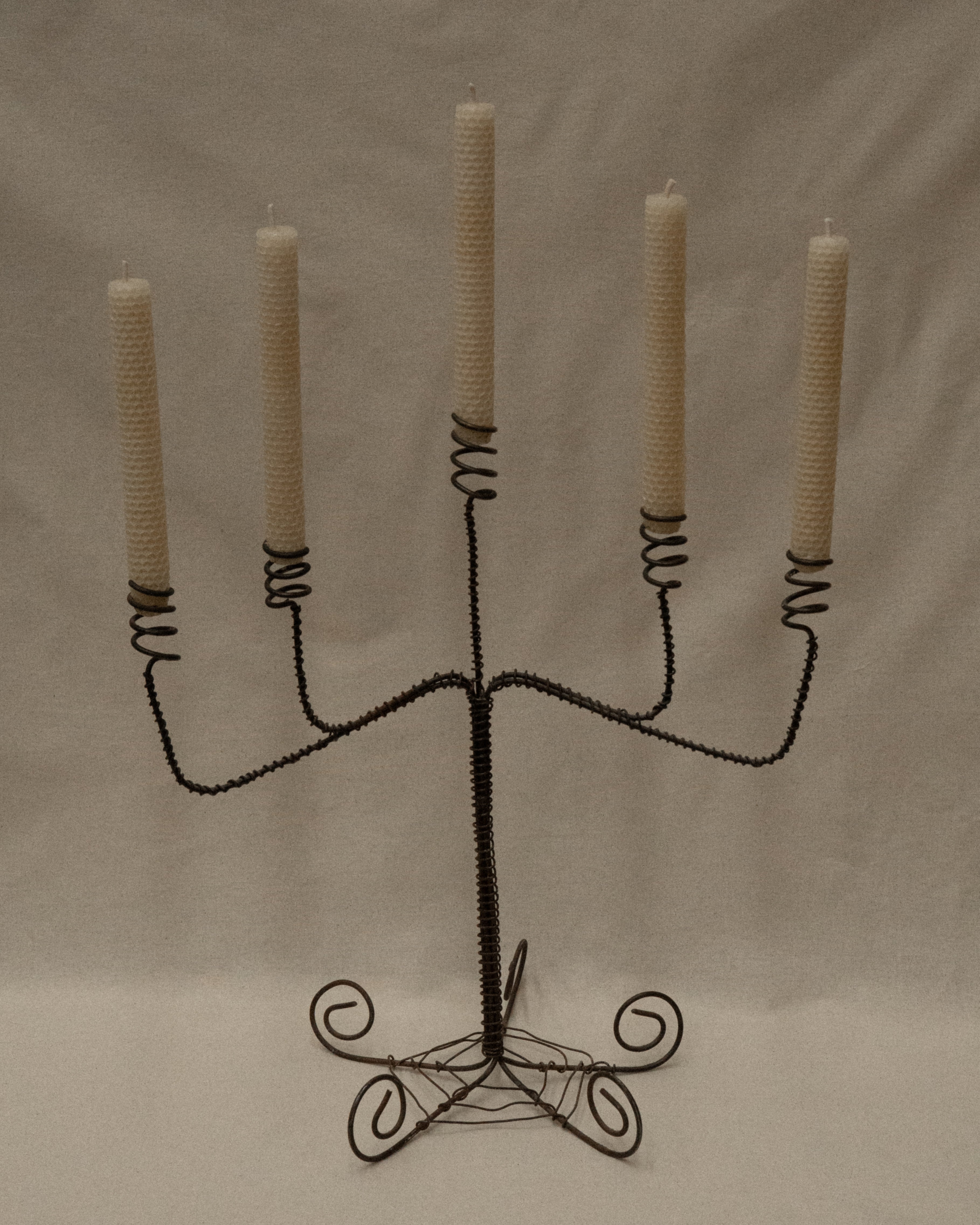 Wrought iron twisted candelabra with spiral feet