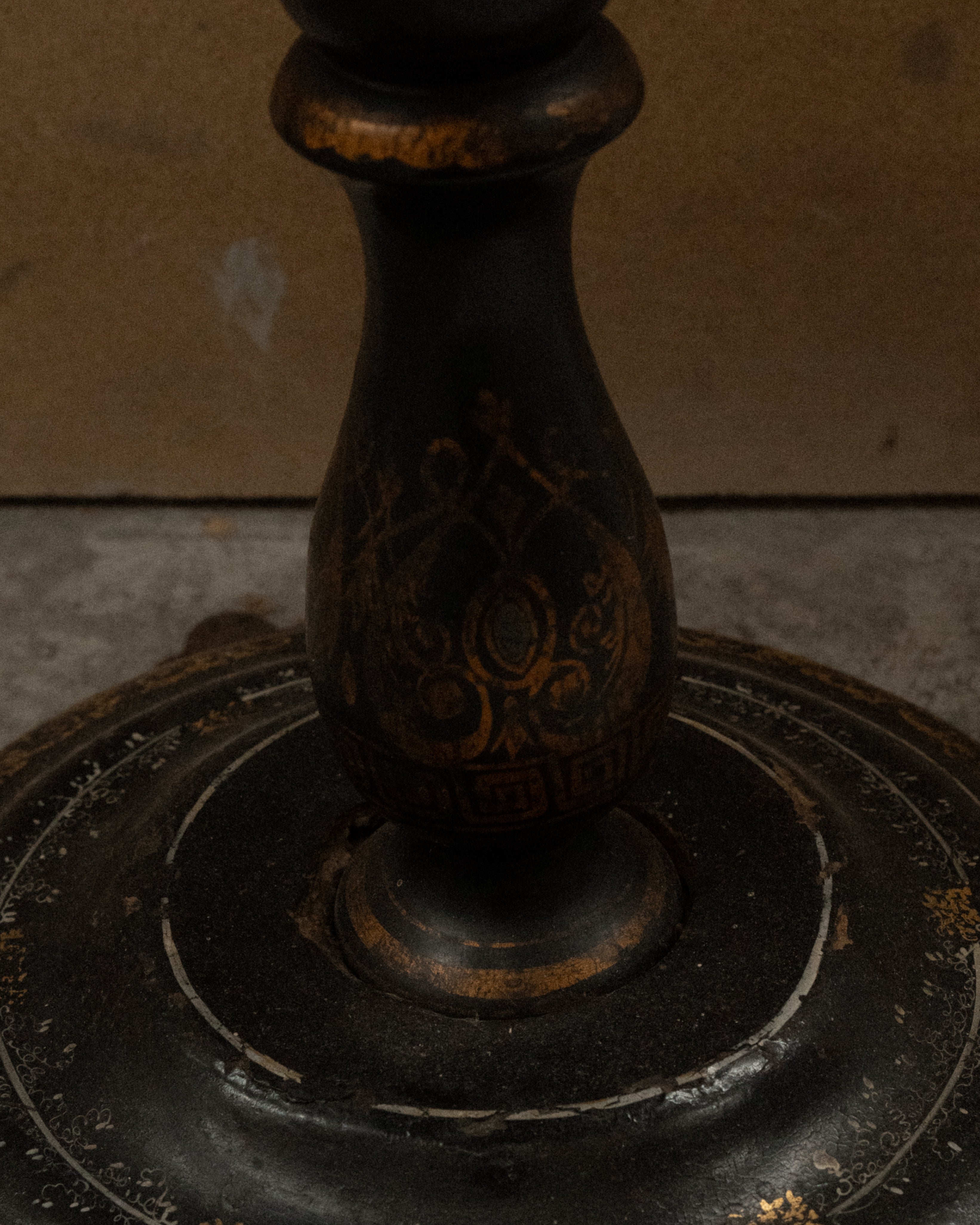 Paper mache and mother of pearl inlaid table likely made between mid to late 19th century