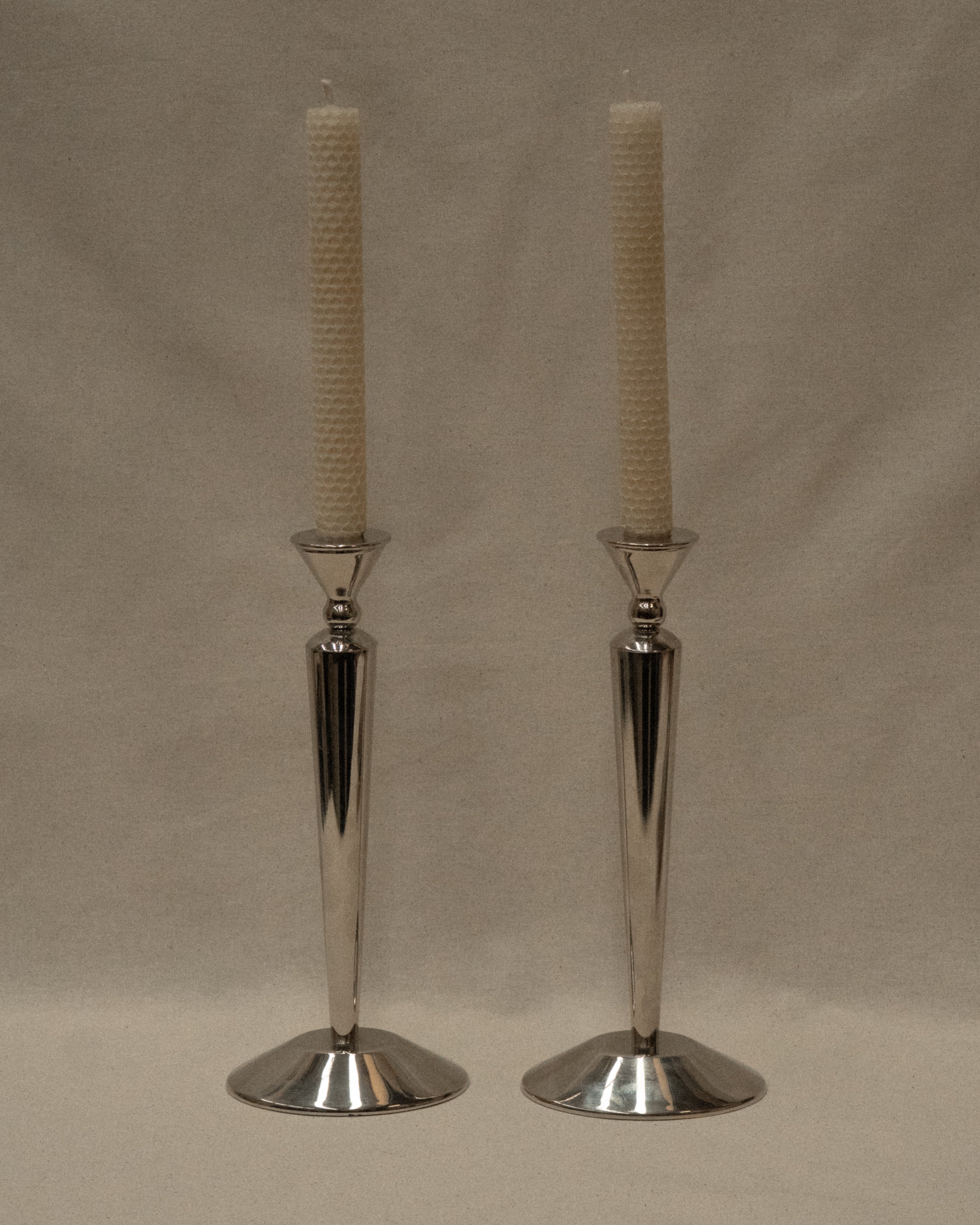 Pair of art deco style aluminuim candle holders
