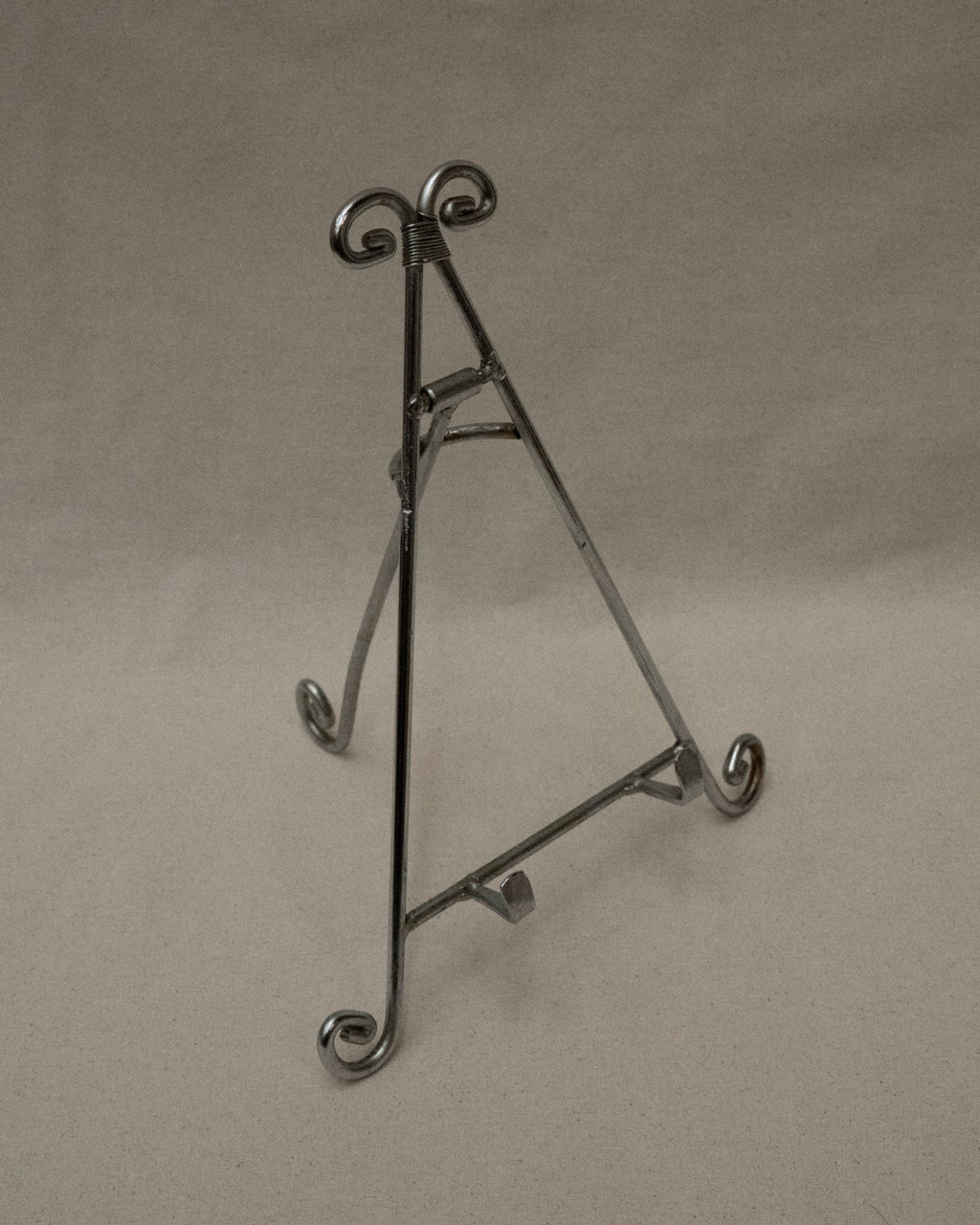 Chrome book stand with spiral feet and top