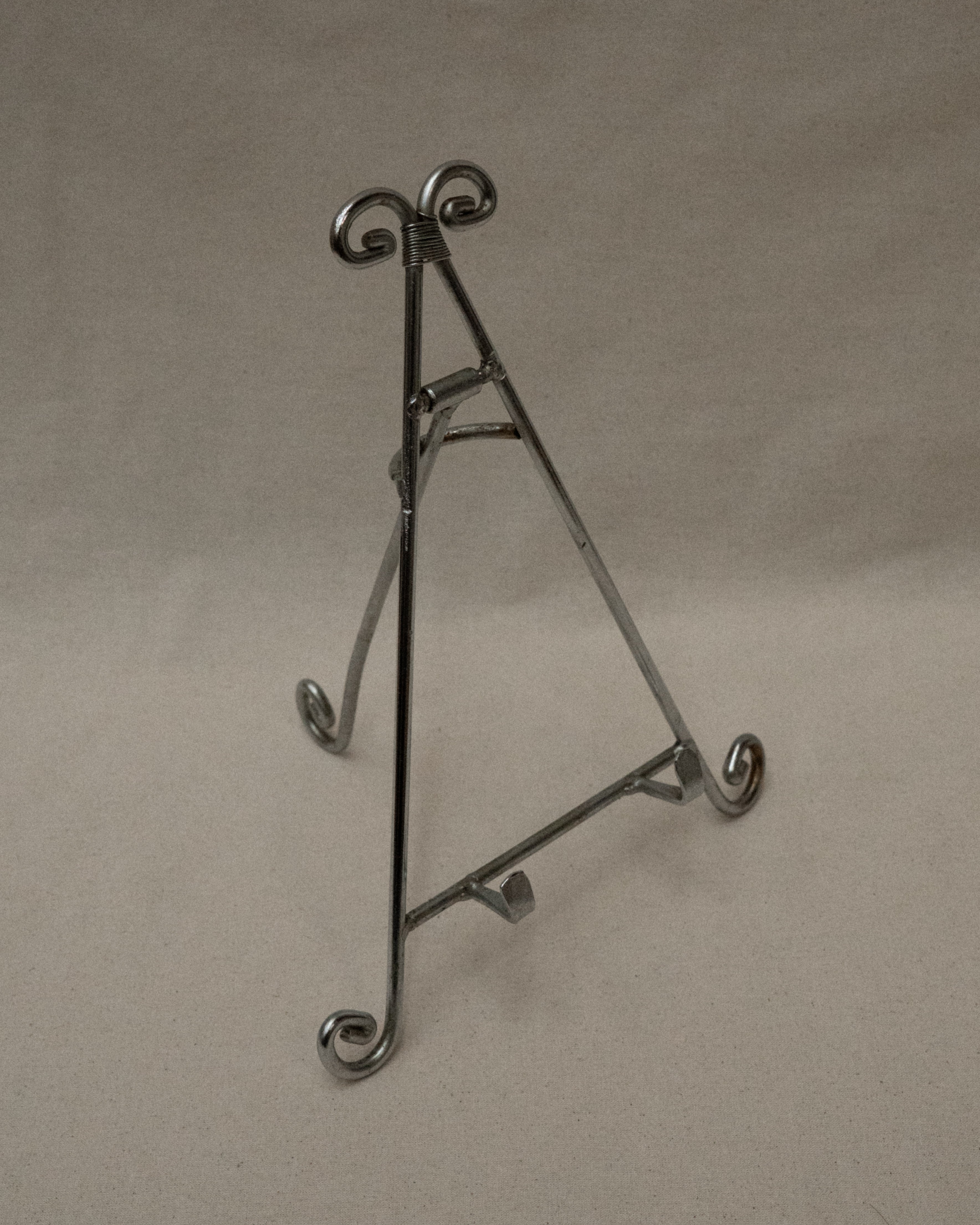 Chrome book stand with spiral feet and top