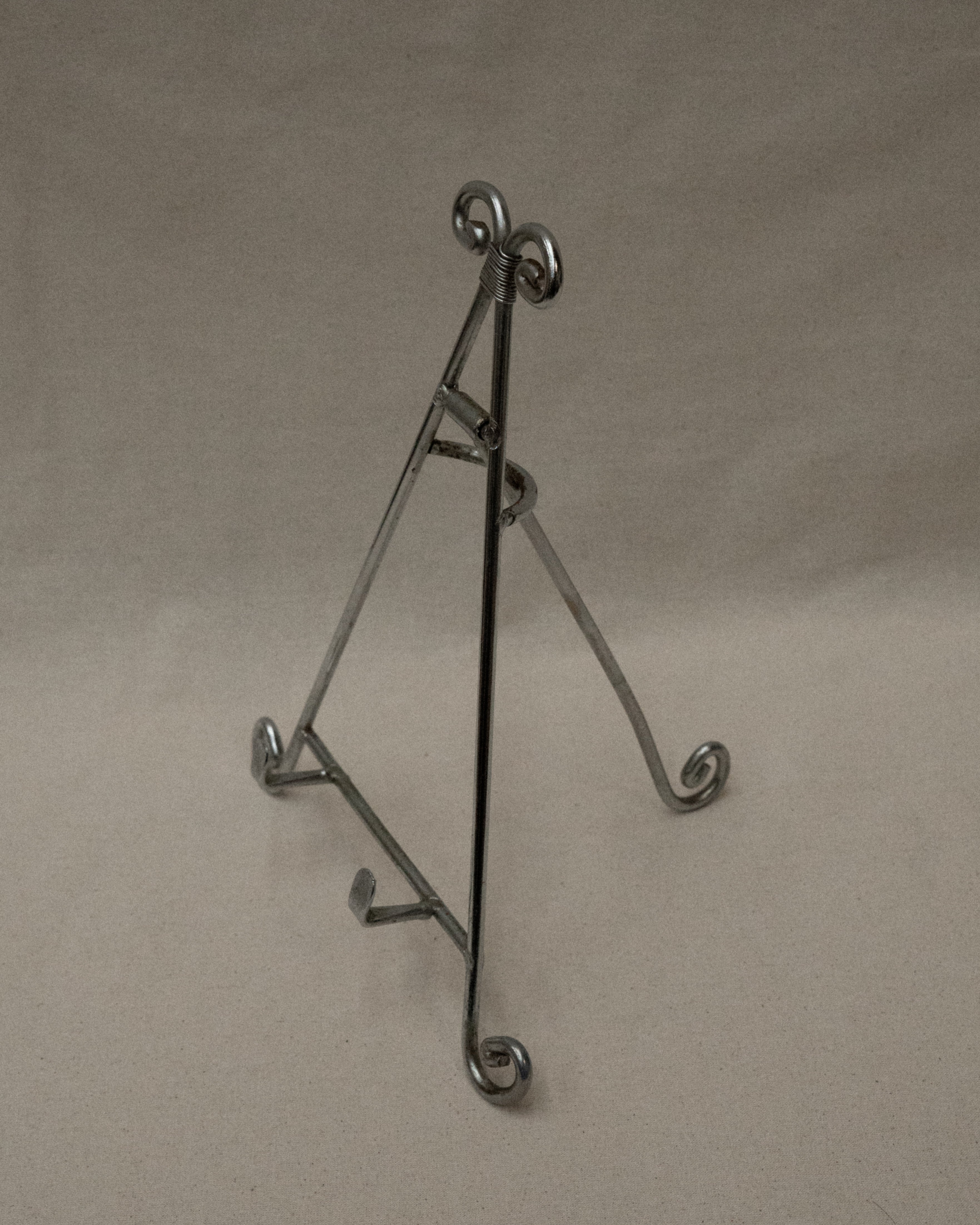 Chrome book stand with spiral feet and top