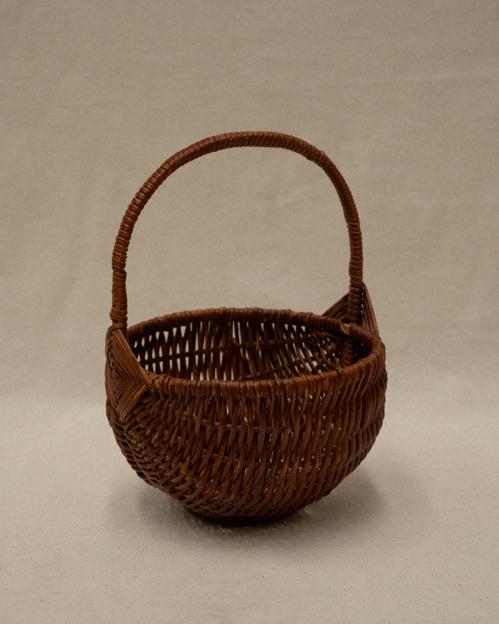 Small wicker basket with handle