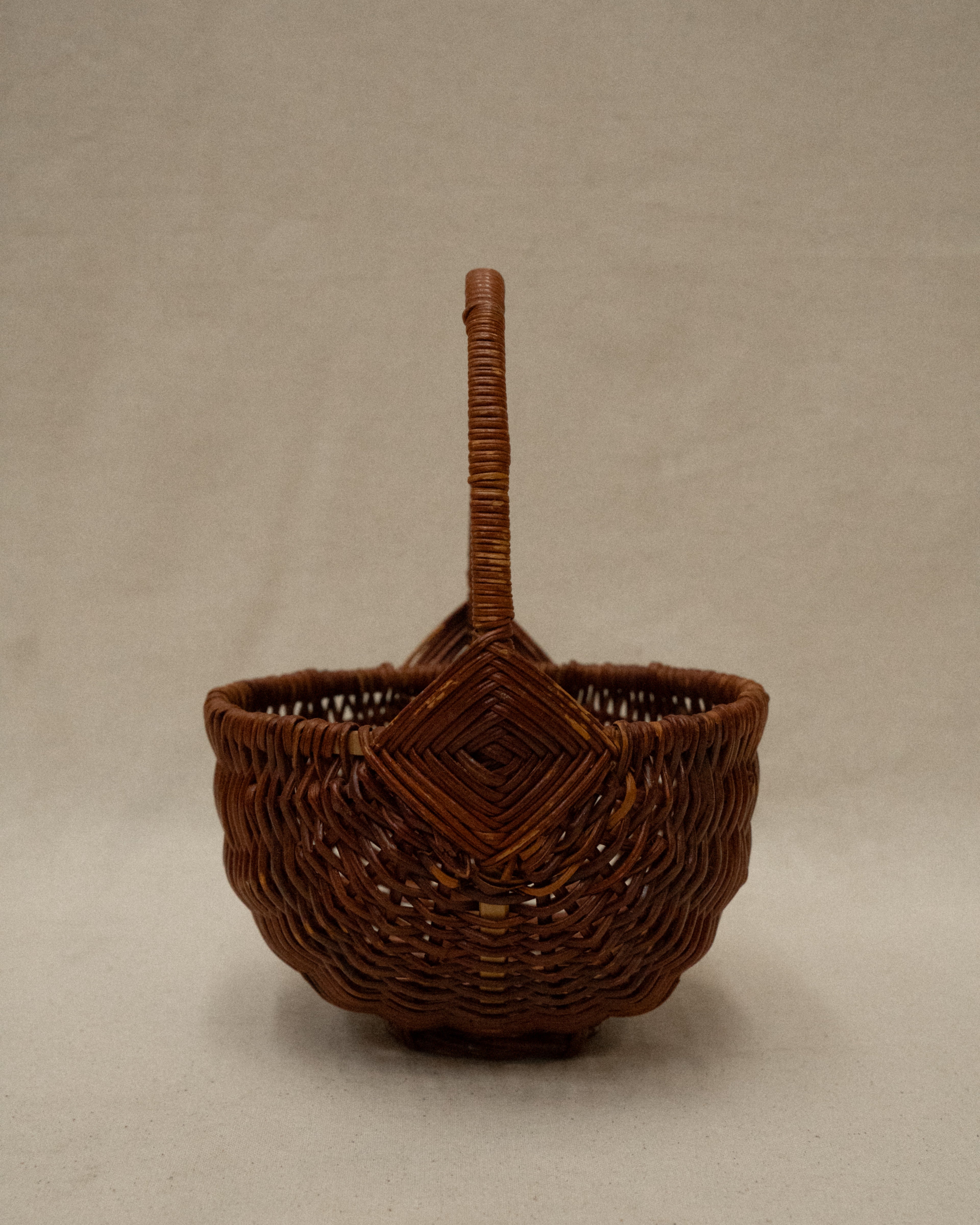Small wicker basket with handle