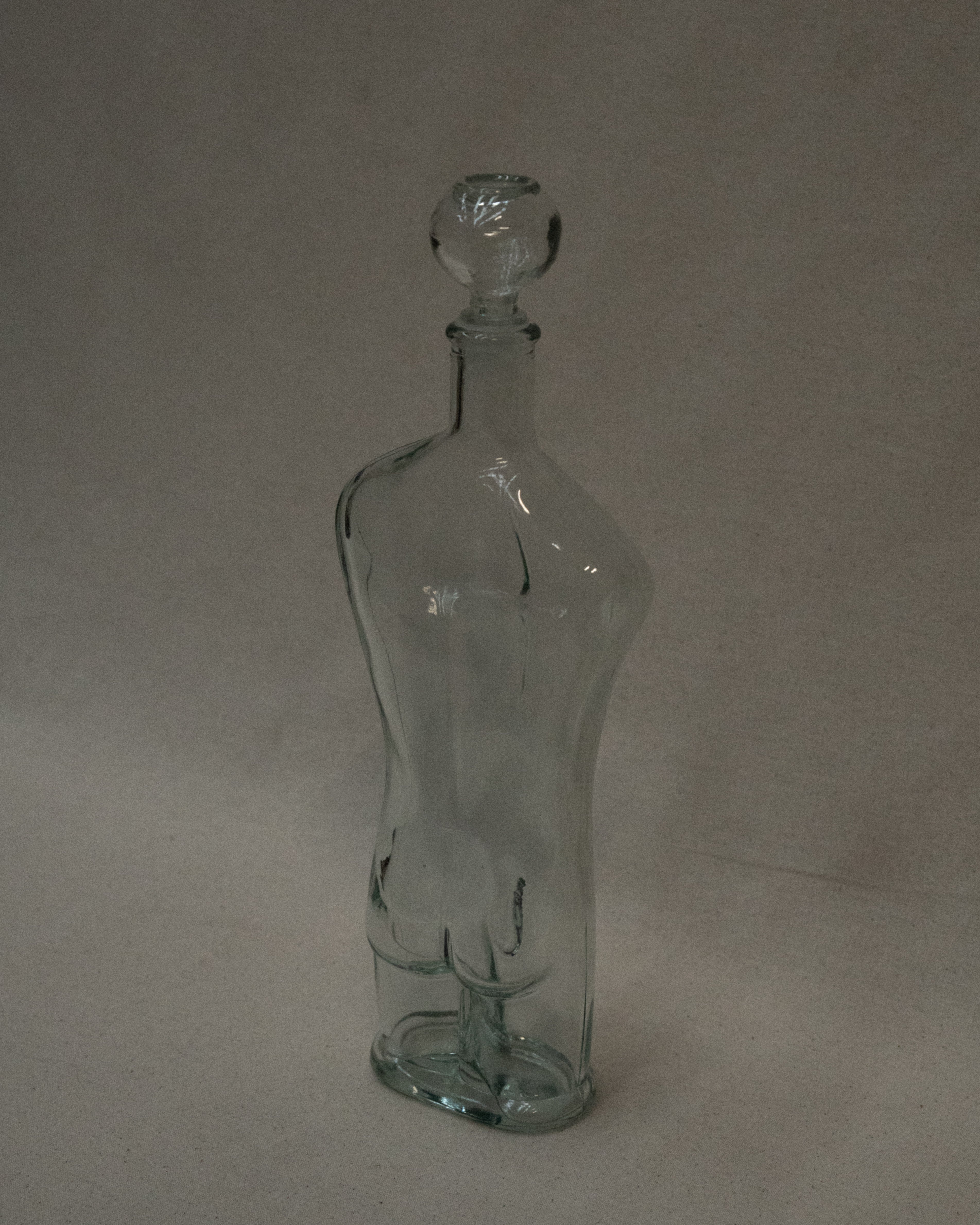 Male torso glass bottle with stopper