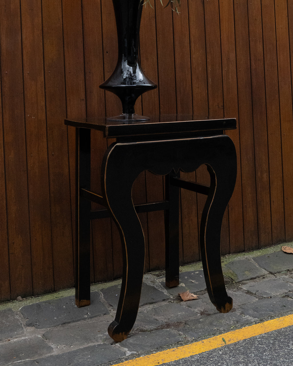 Black laquered chinese table with exposed edges