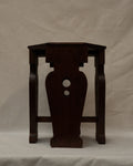 Wooden stool with vase shaped supports