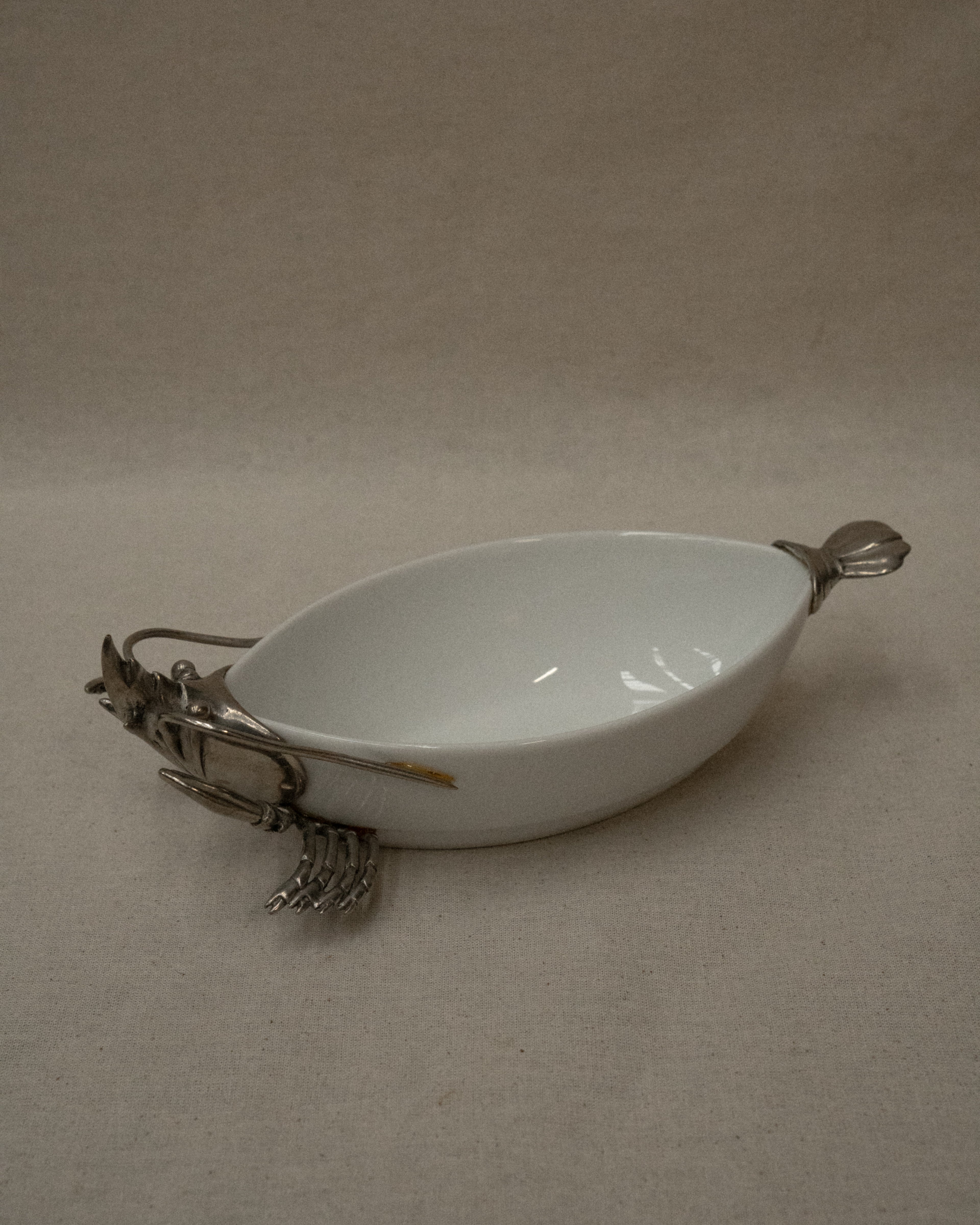 White ceramic dish with silver coloured lobster